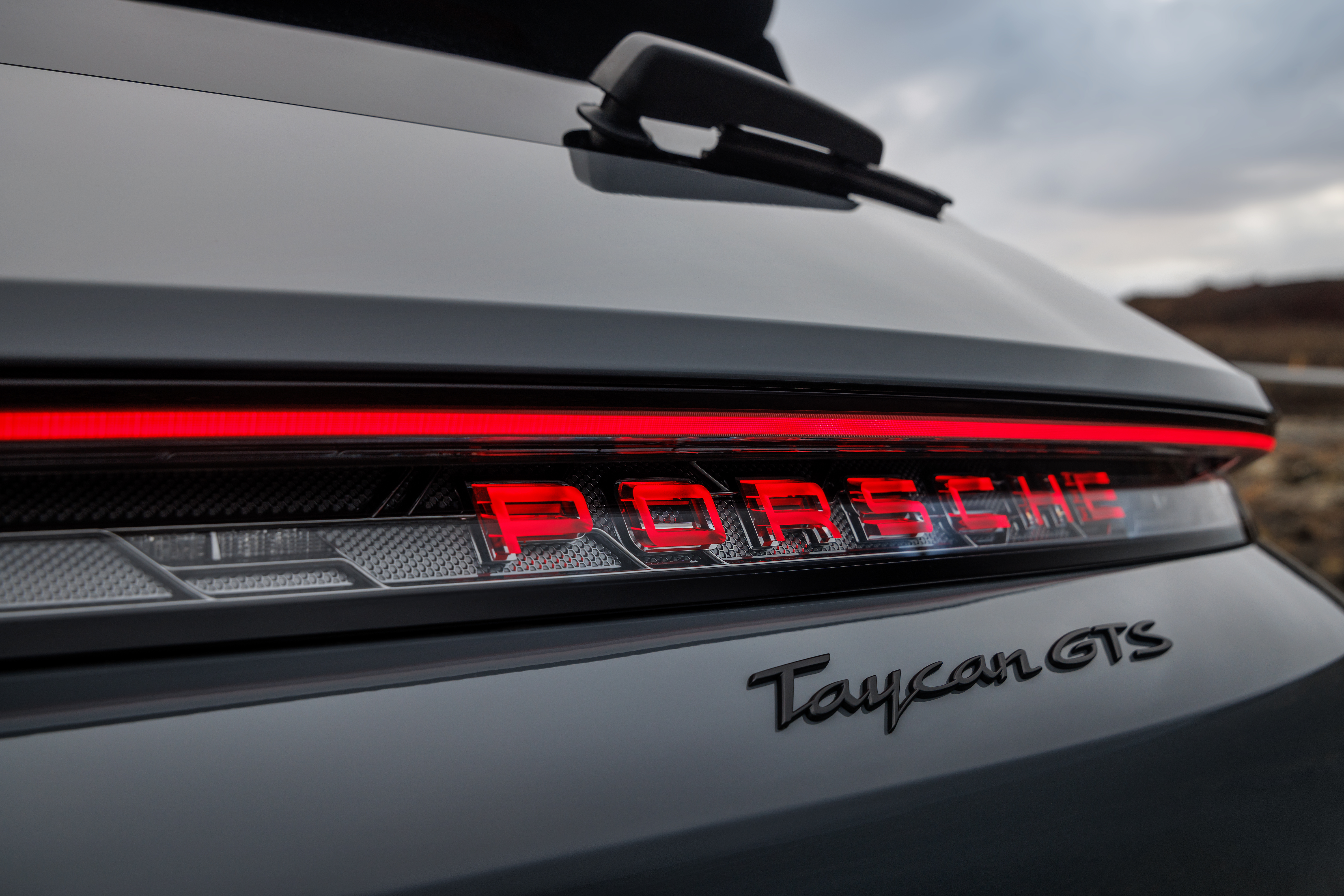 Rear logo of a 2025 Porsche Taycan GTS