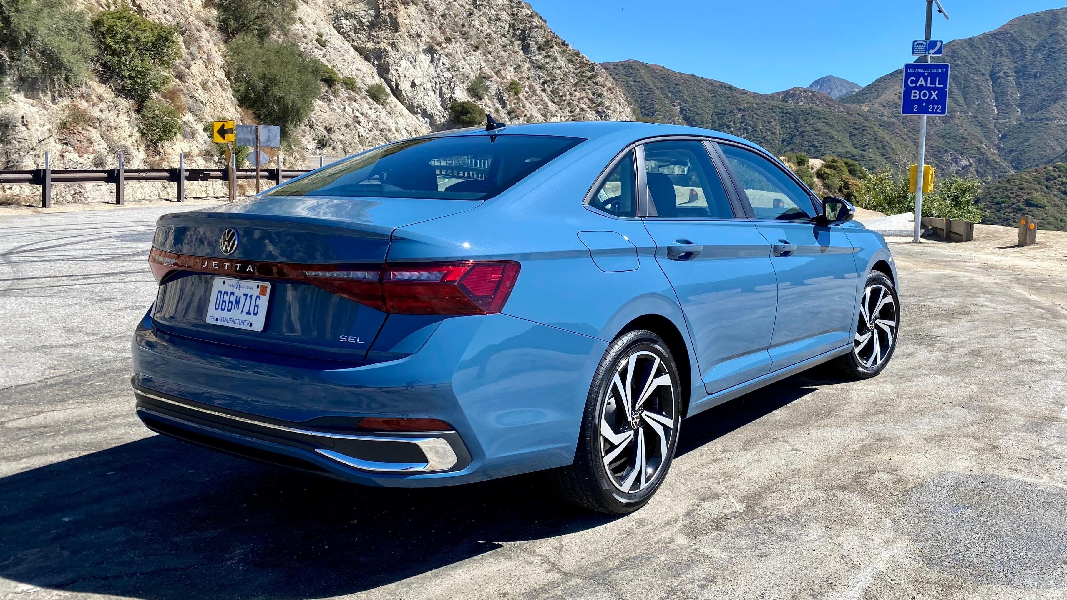 A rear 3/4 shot of the blue Jetta SEL