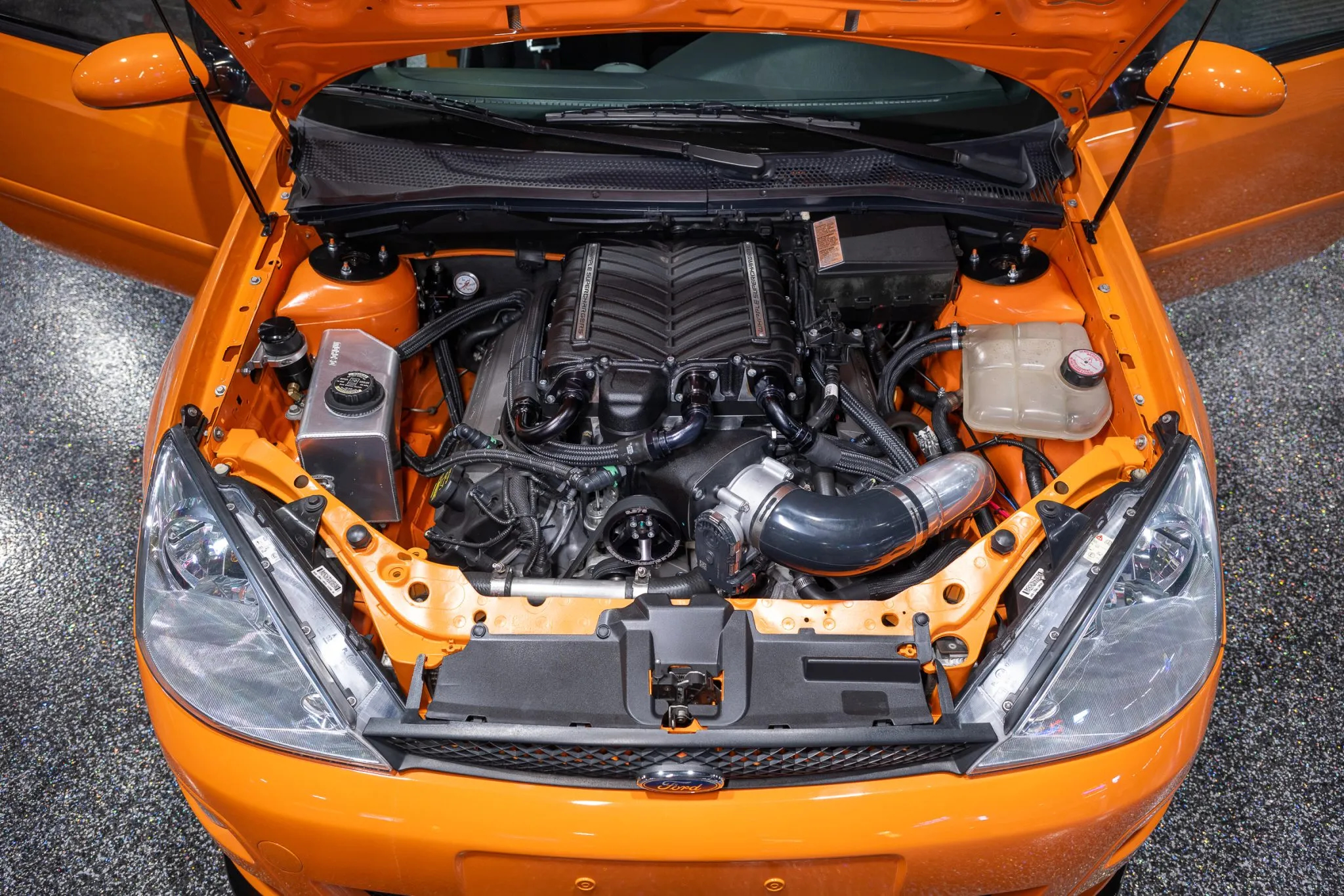 An underhood shot of the Focus' supercharged 5.0-liter V8