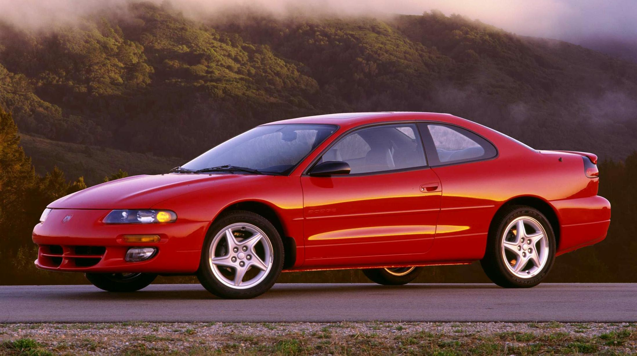 Red 1997 Dodge Avenger side profile view