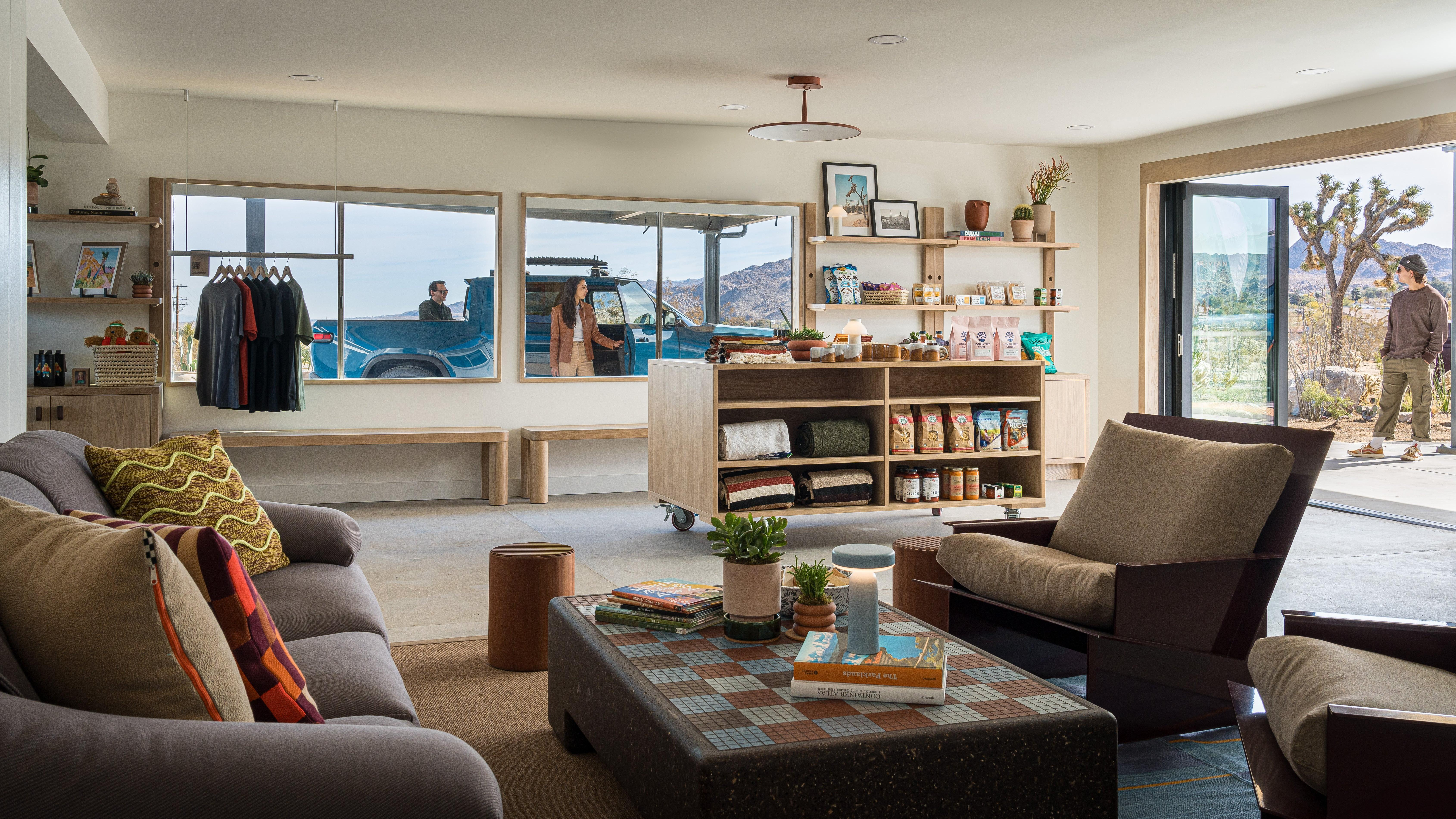 A photo of the charging outpost's interior showing a couch and chairs and books