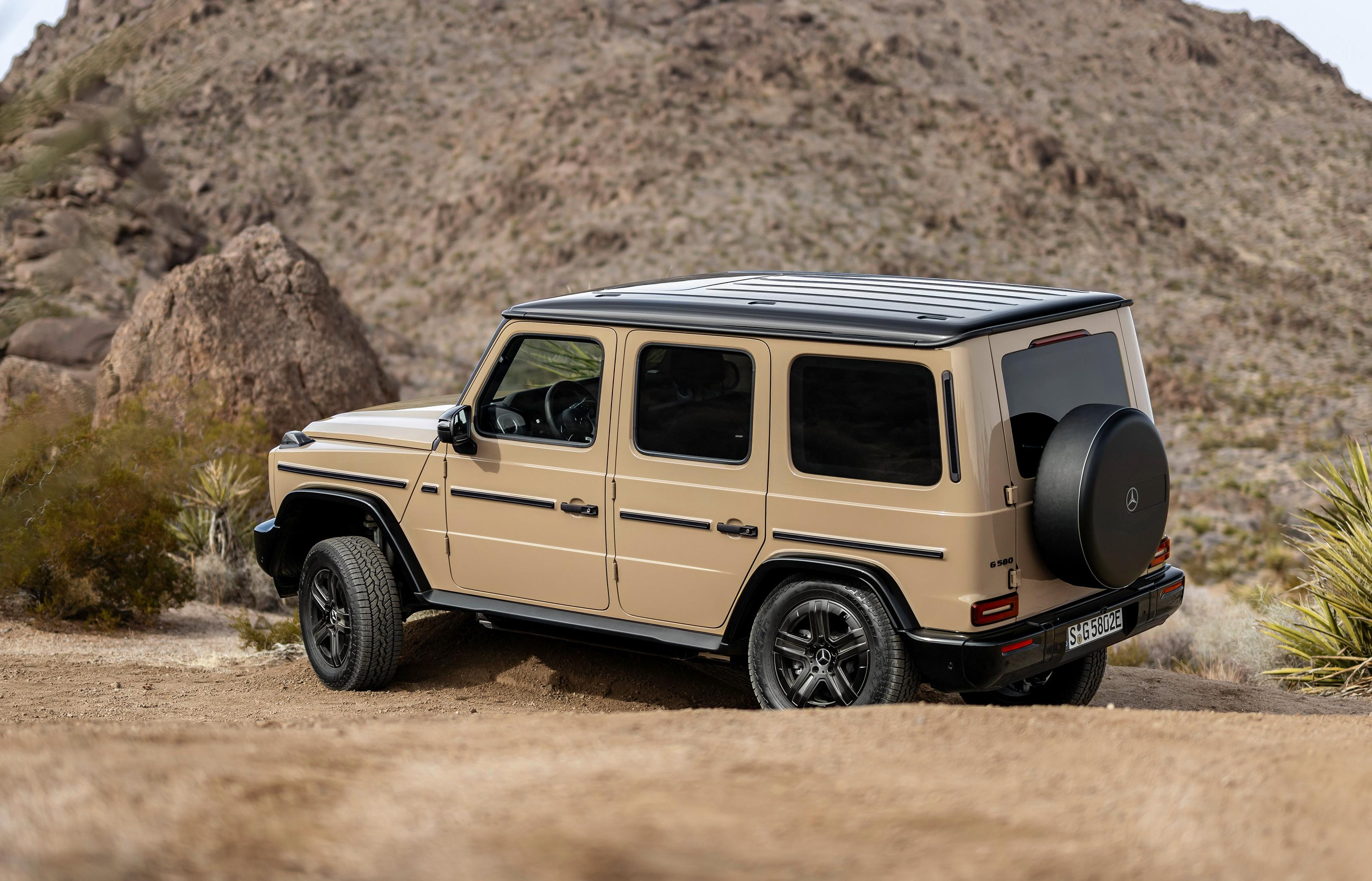 Rear 3/4 view of a beige 2025 Mercedes-Benz G580 EV