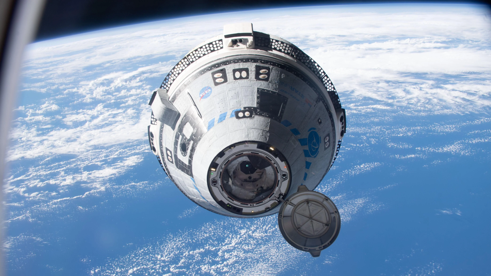 A photo of the Starliner craft in space. 