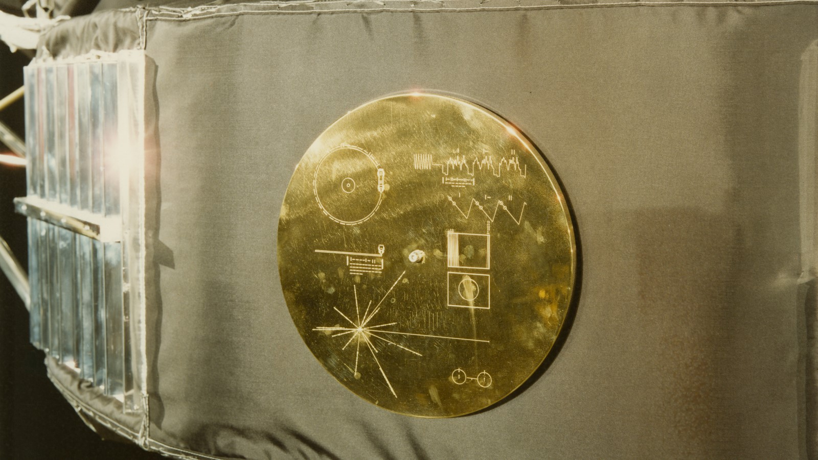 A photo of the gold record on the side of the Voyager probe. 