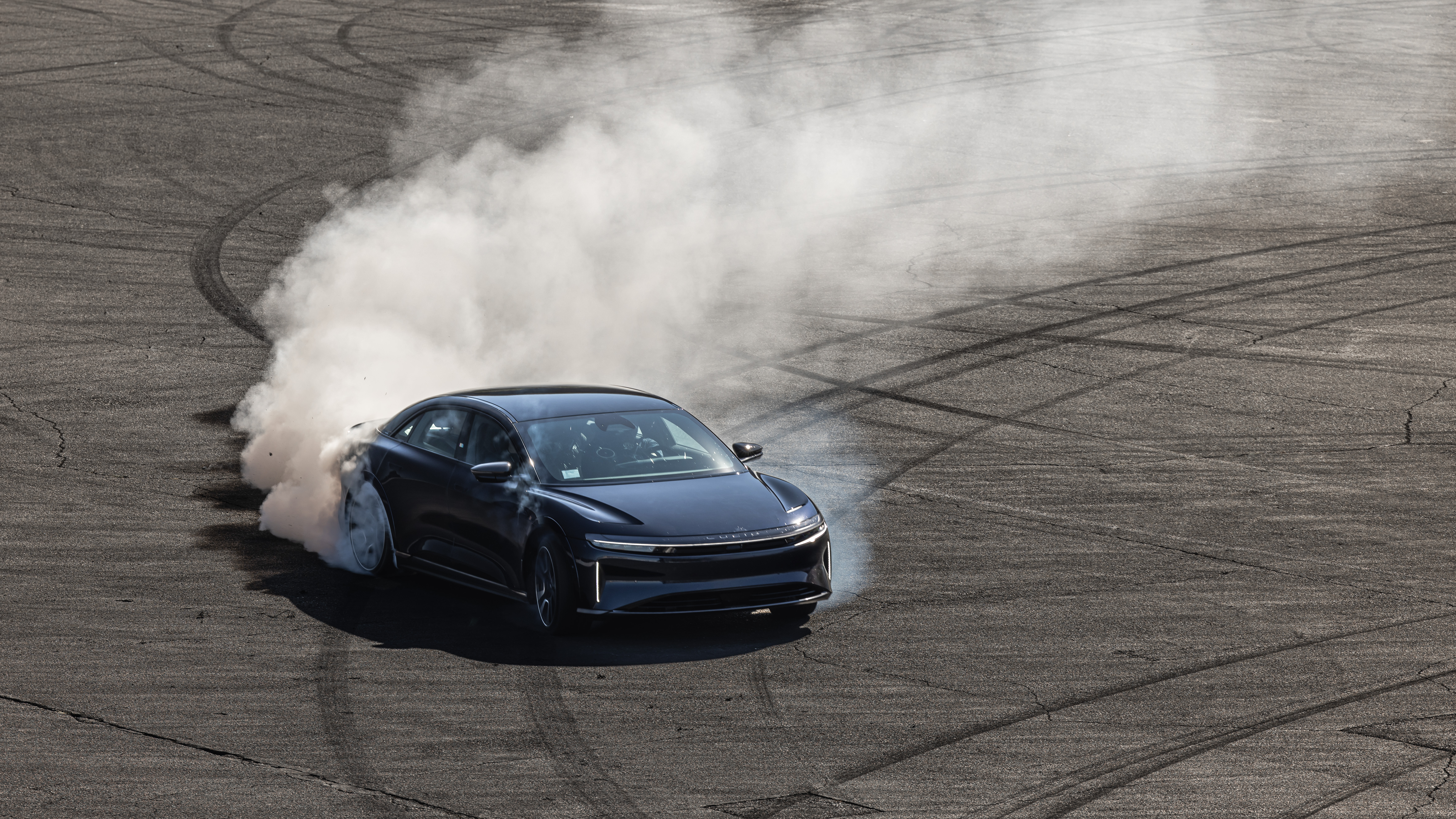 Lucid Air Sapphire does a large, smoky four-wheel burnout