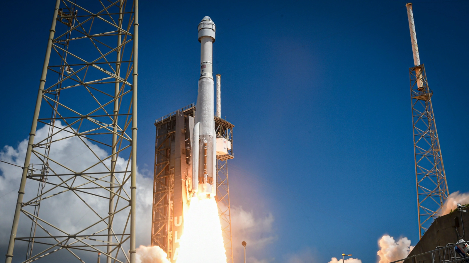 A photo of the Starliner craft launching to space. 