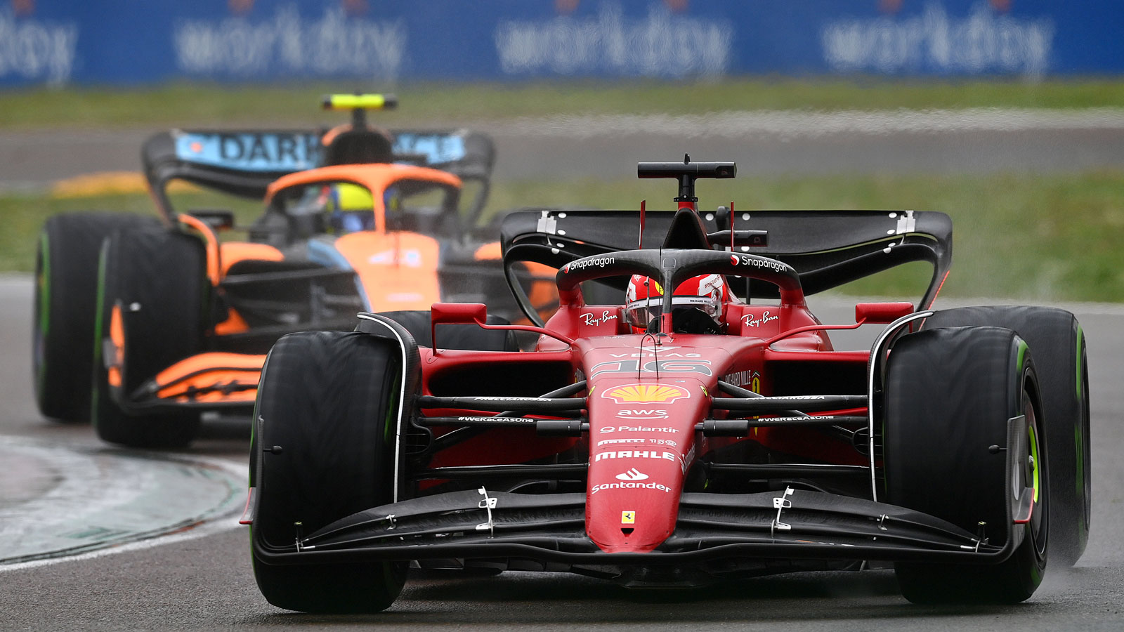 A photo of Charles Leclerc racing Lando Norris in Italy. 