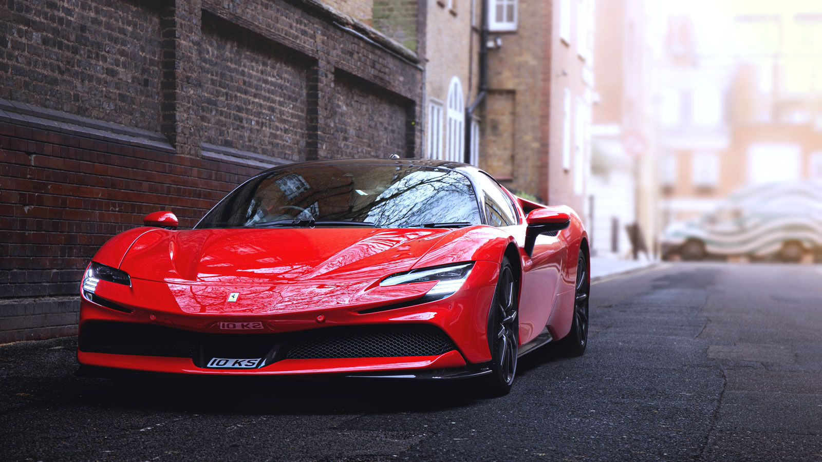 A photo of a red Ferrari SF90 Stradale on a London street. 