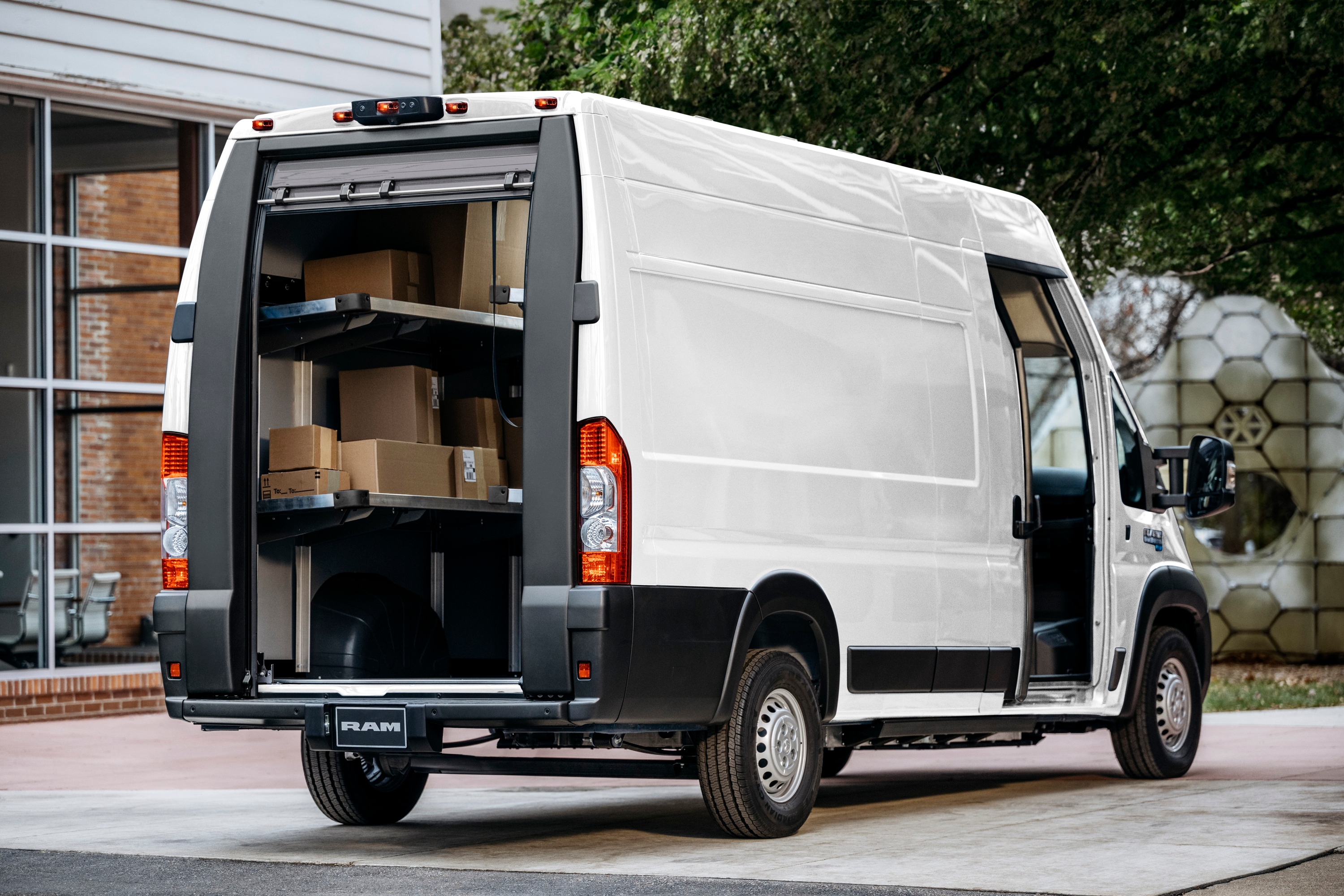 Rear 3/4 view of a white Ram ProMaster EV van