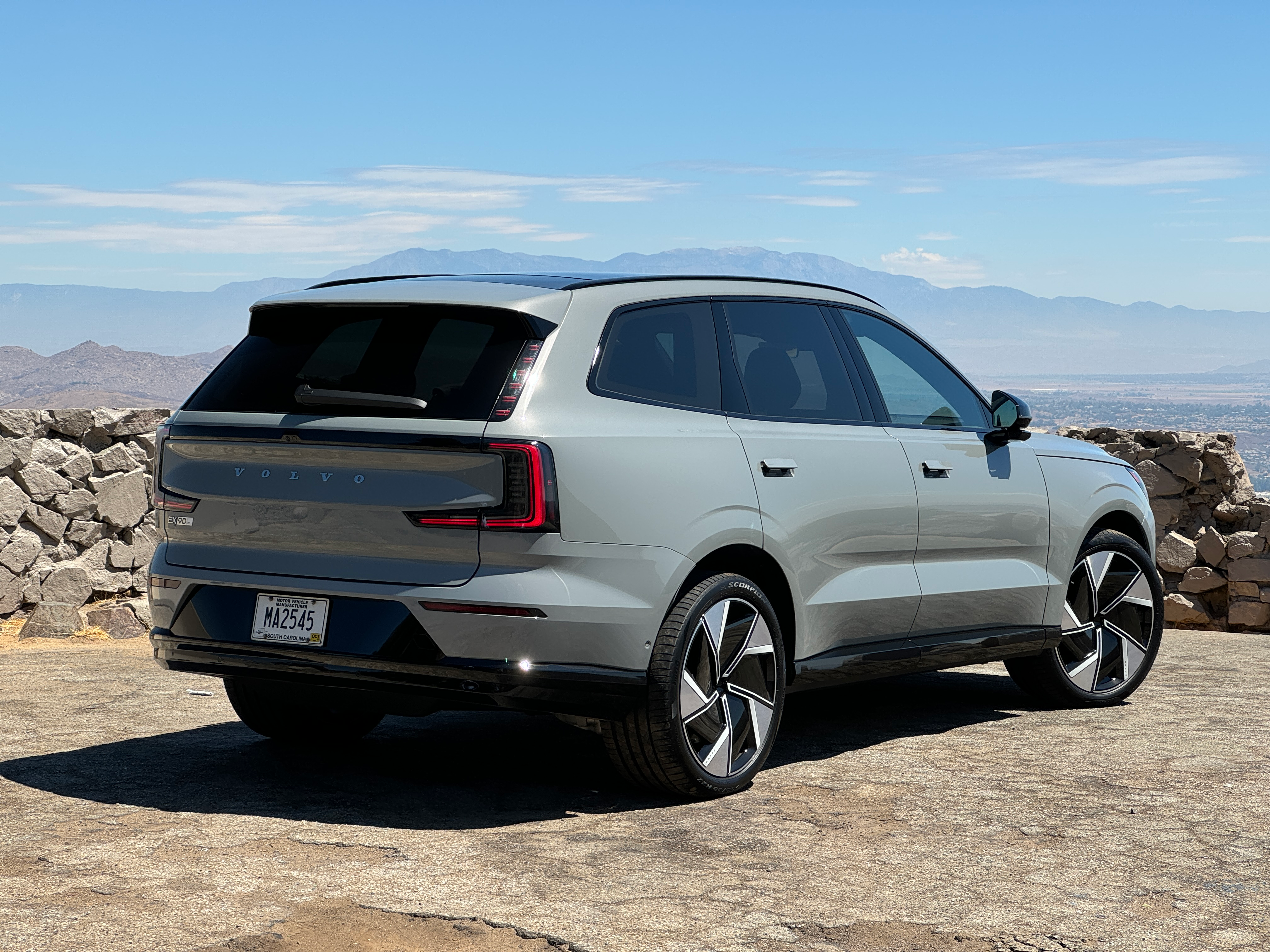 Rear 3/4 view of a grey Volvo EX90