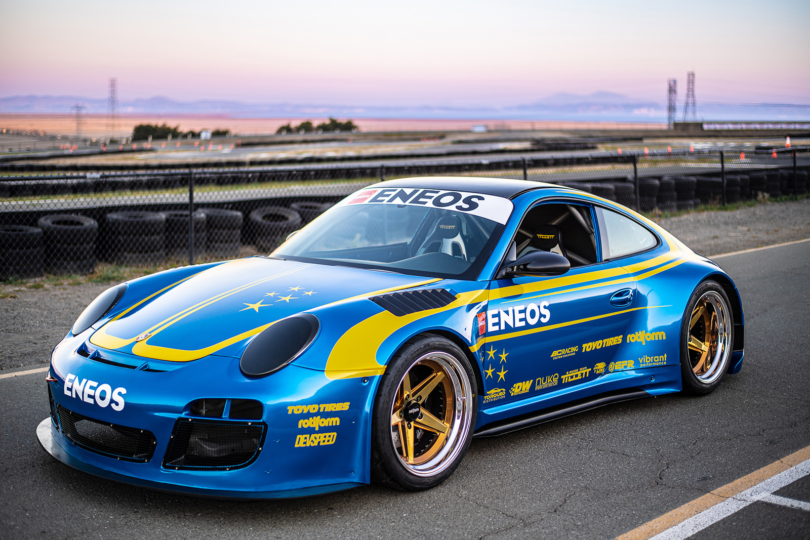 Front quarter view of Porsche 911 GT3 STI built by DevSpeed Motorsports for Eneos.