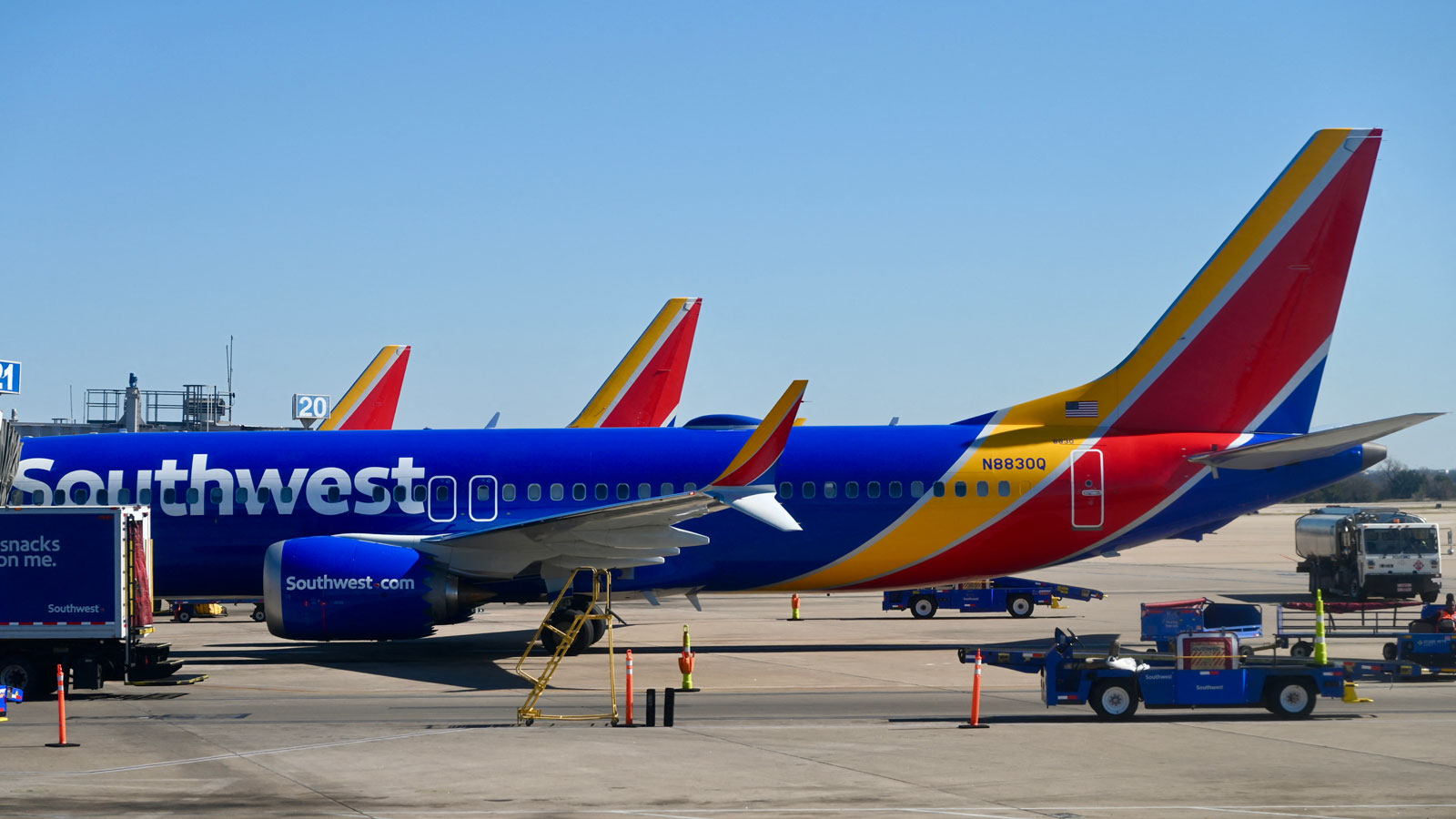 A photo of a Southwest plane at an airport. 