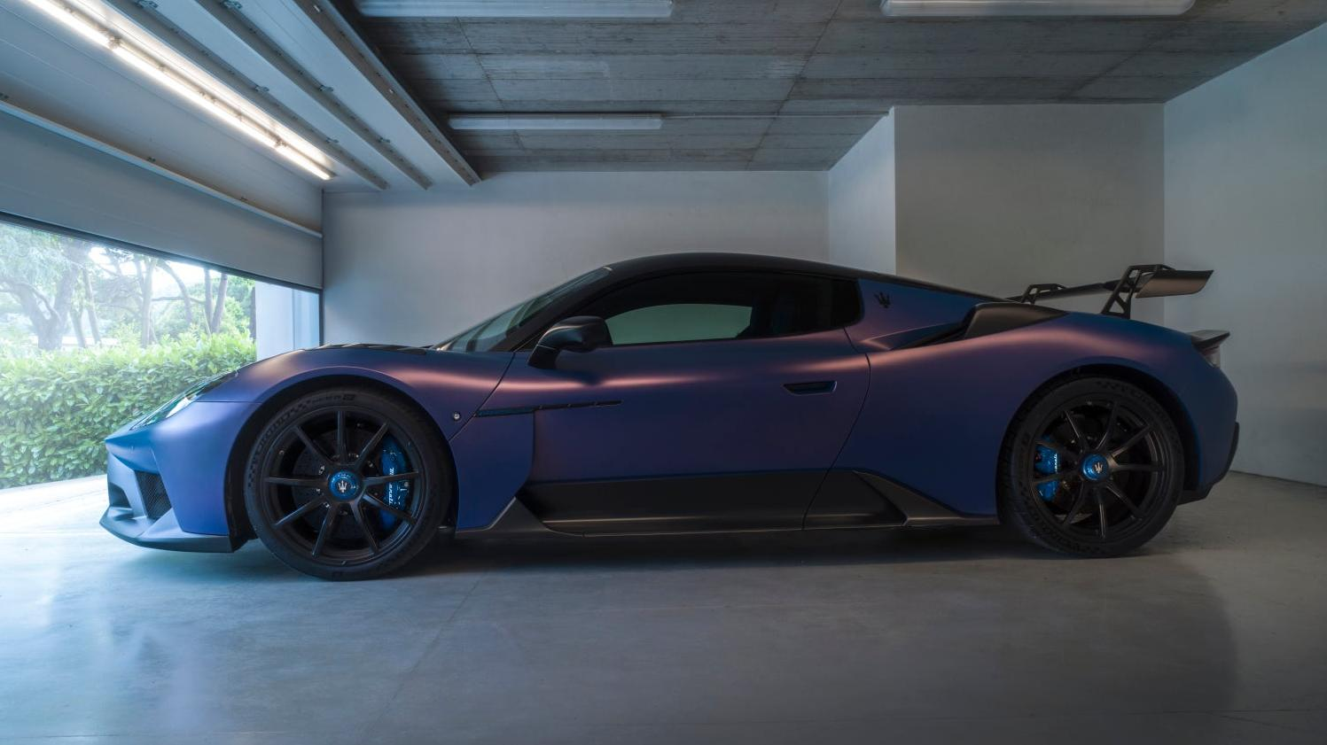 A side shot of the GT2 Stradale in purple in a garage