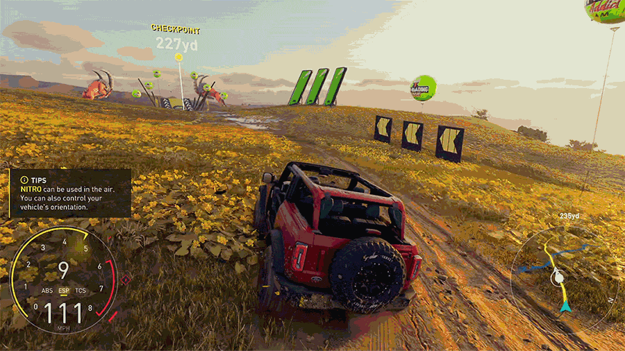 A GIF of a Ford Bronco driving off road and launching off a ramp in The Crew Motorfest.