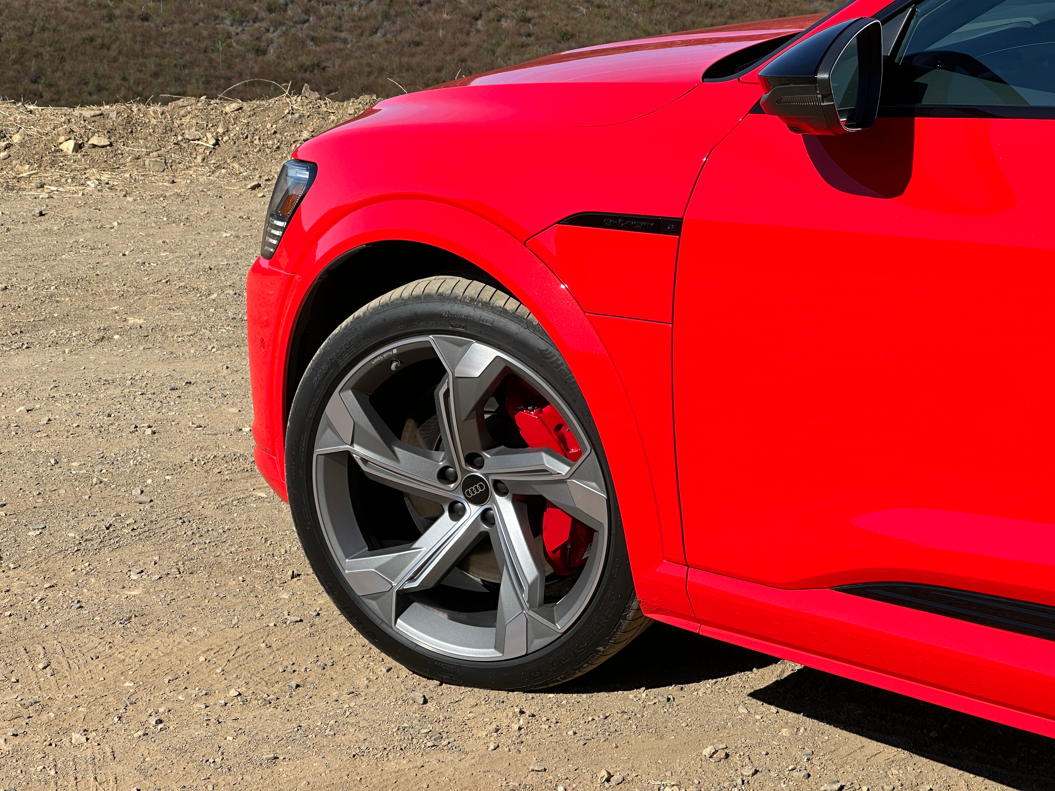 Detail shot of the wheel of a bright red Audi SQ8 E-Tron Sportback