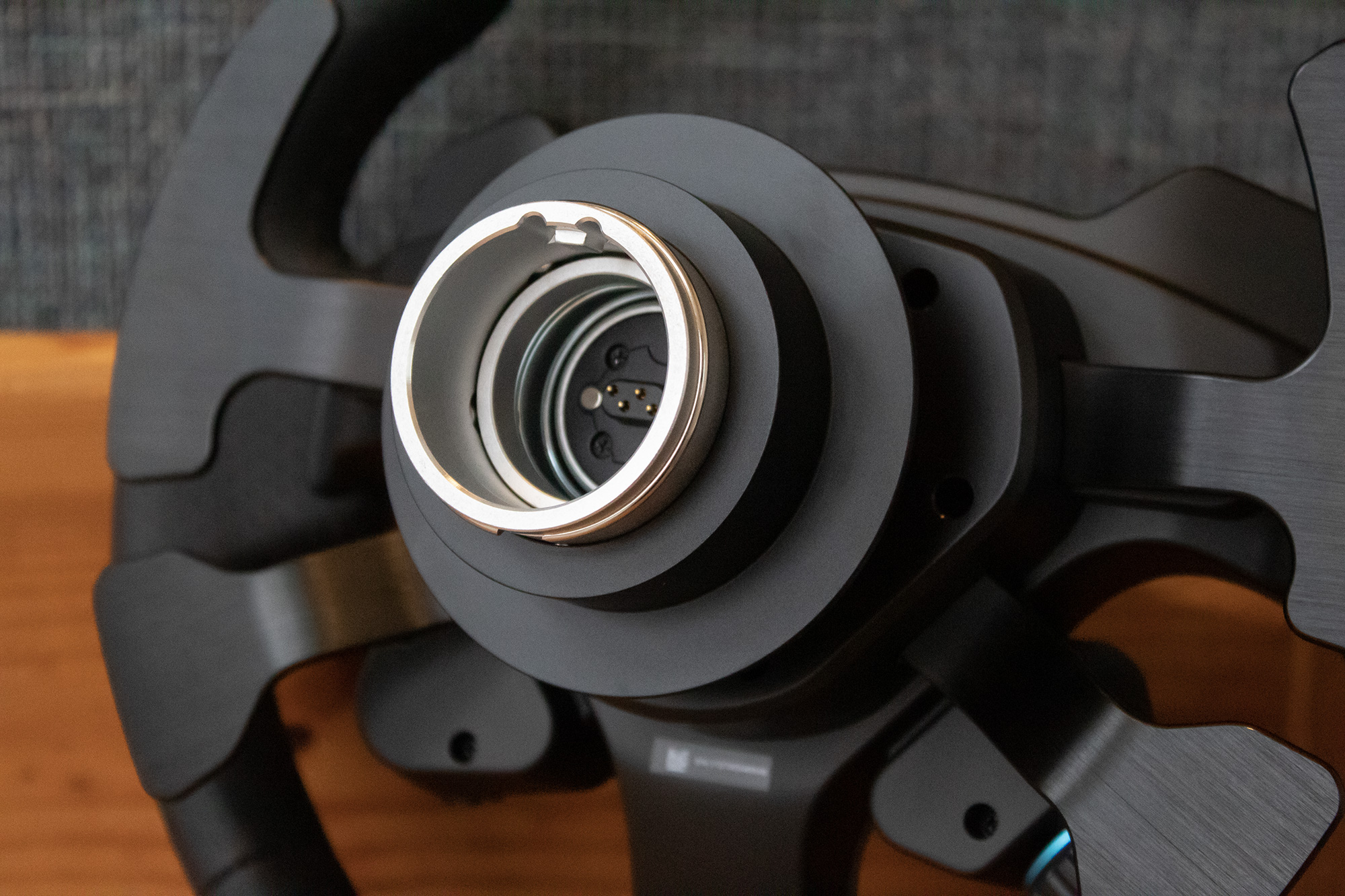 View of quick release mechanism and connector on the back of the Logitech G Pro steering wheel rim.