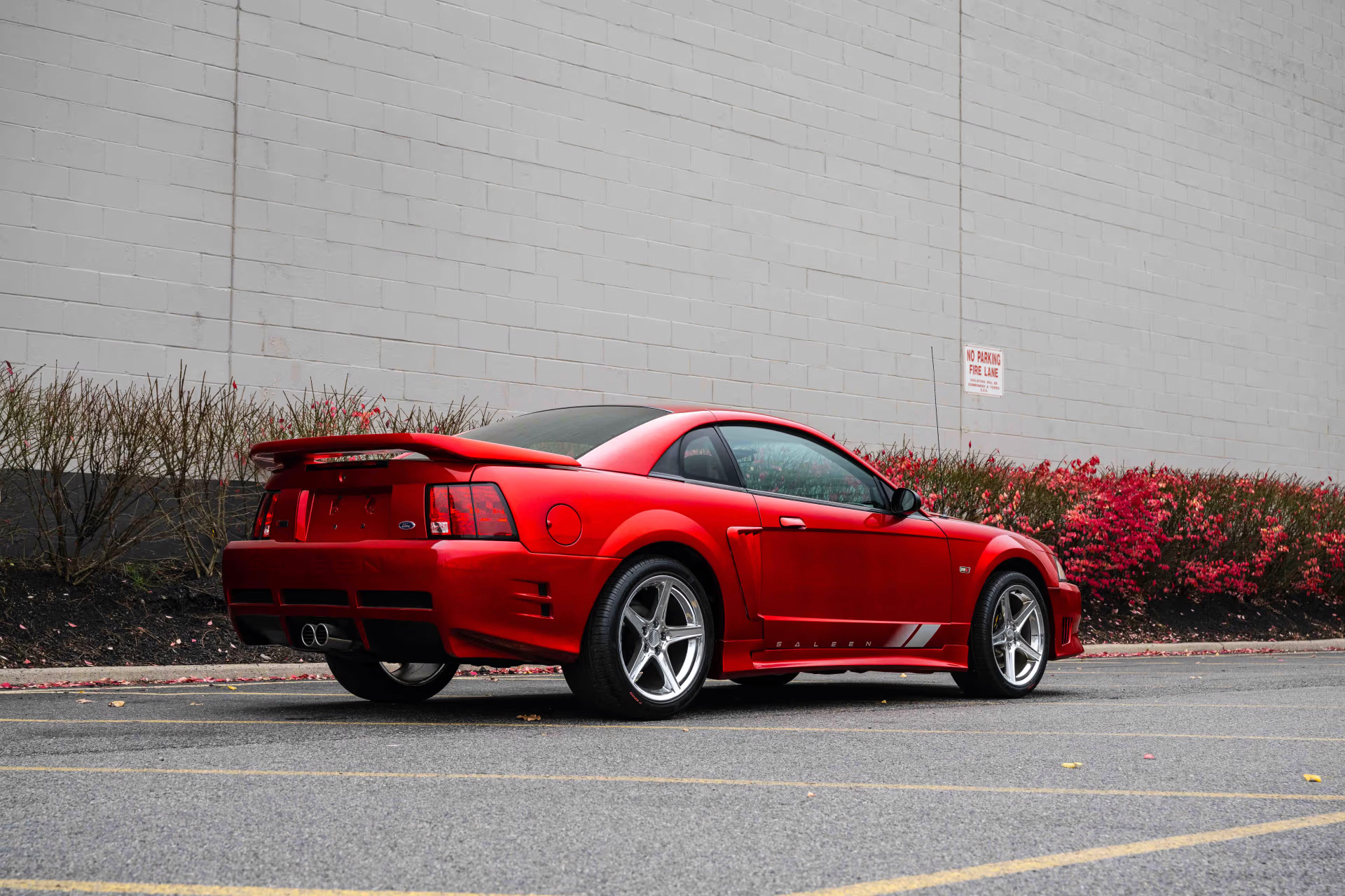 Rear 3/4 view of a red Saleen Ford Mustang