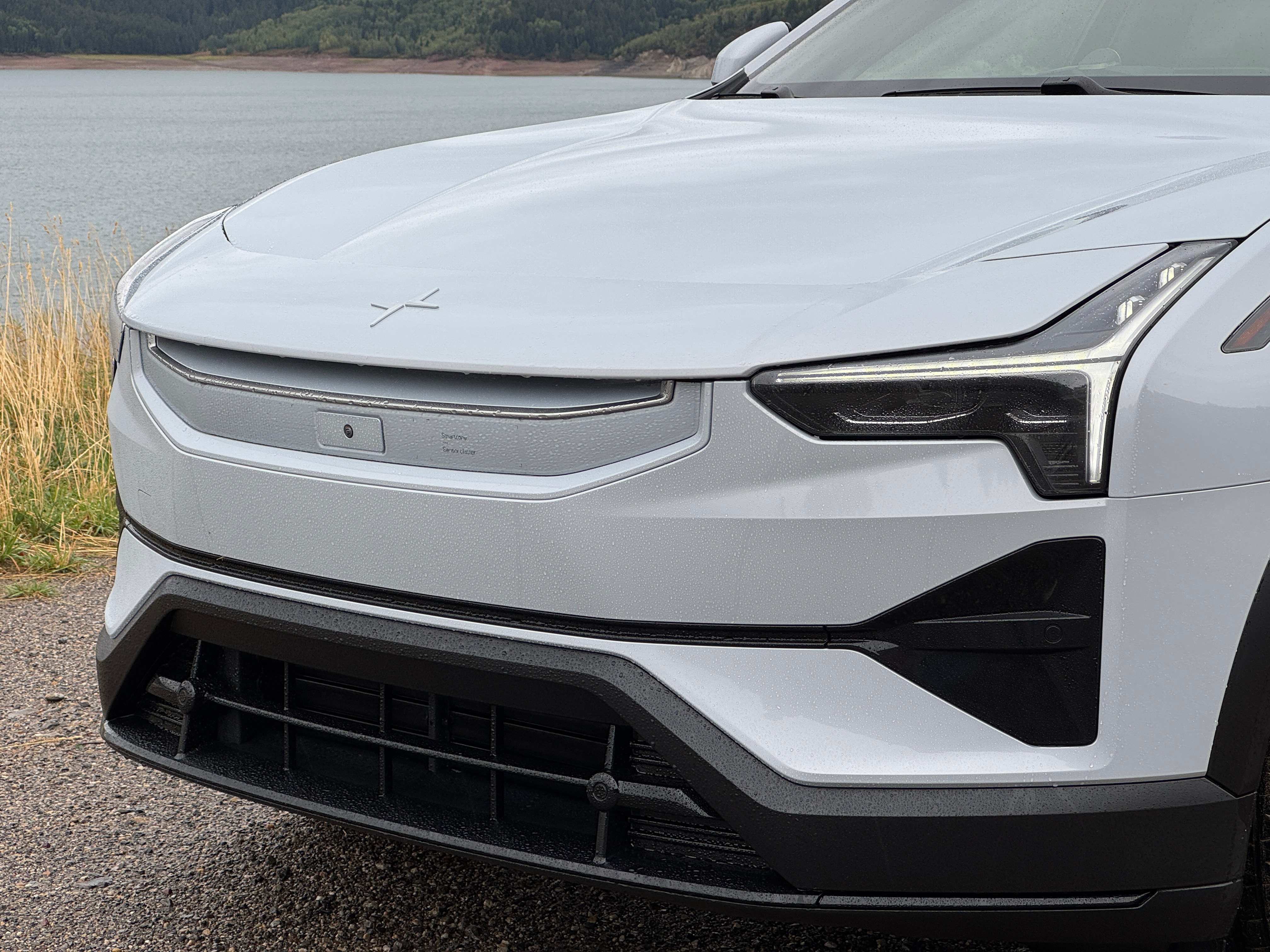 Front end detail of a grey Polestar 3