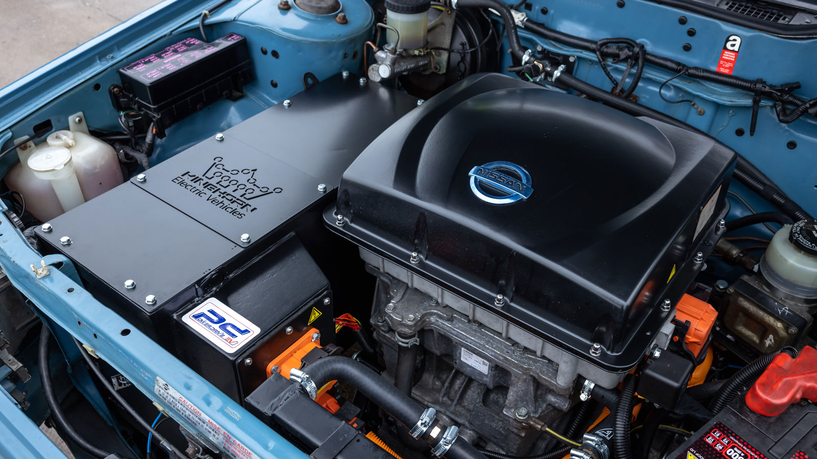 The electric motor in the engine bay of the Nissan Newbird EV 