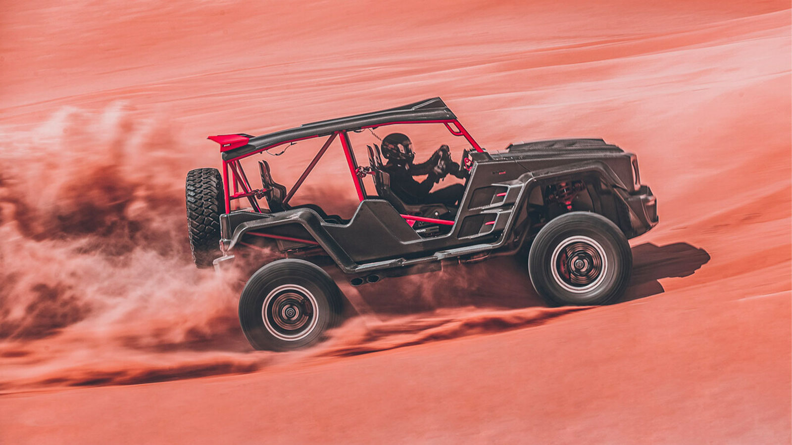 A photo of the Brabus Crawler racing over sand. 