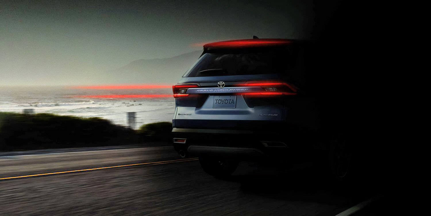 A brightened edit of Toyota's teaser of the upcoming 2023 Grand Highlander, showing the rear of the SUV.