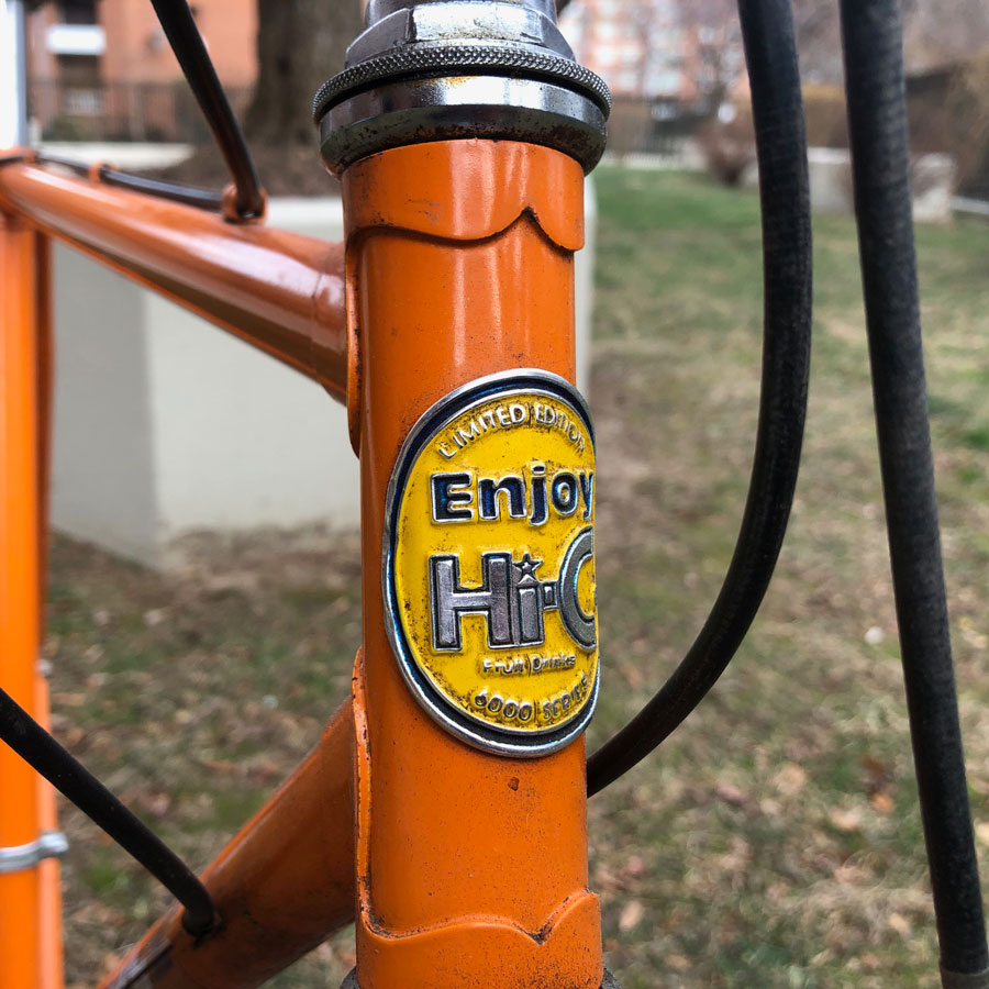 A close up of the yellow badge on the front of the bike. 