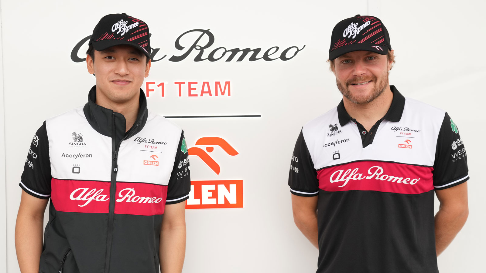 A photo of teammates Zhou Guanyu (L) and Valtteri Bottas (R) in their Alfa Romeo gear. 