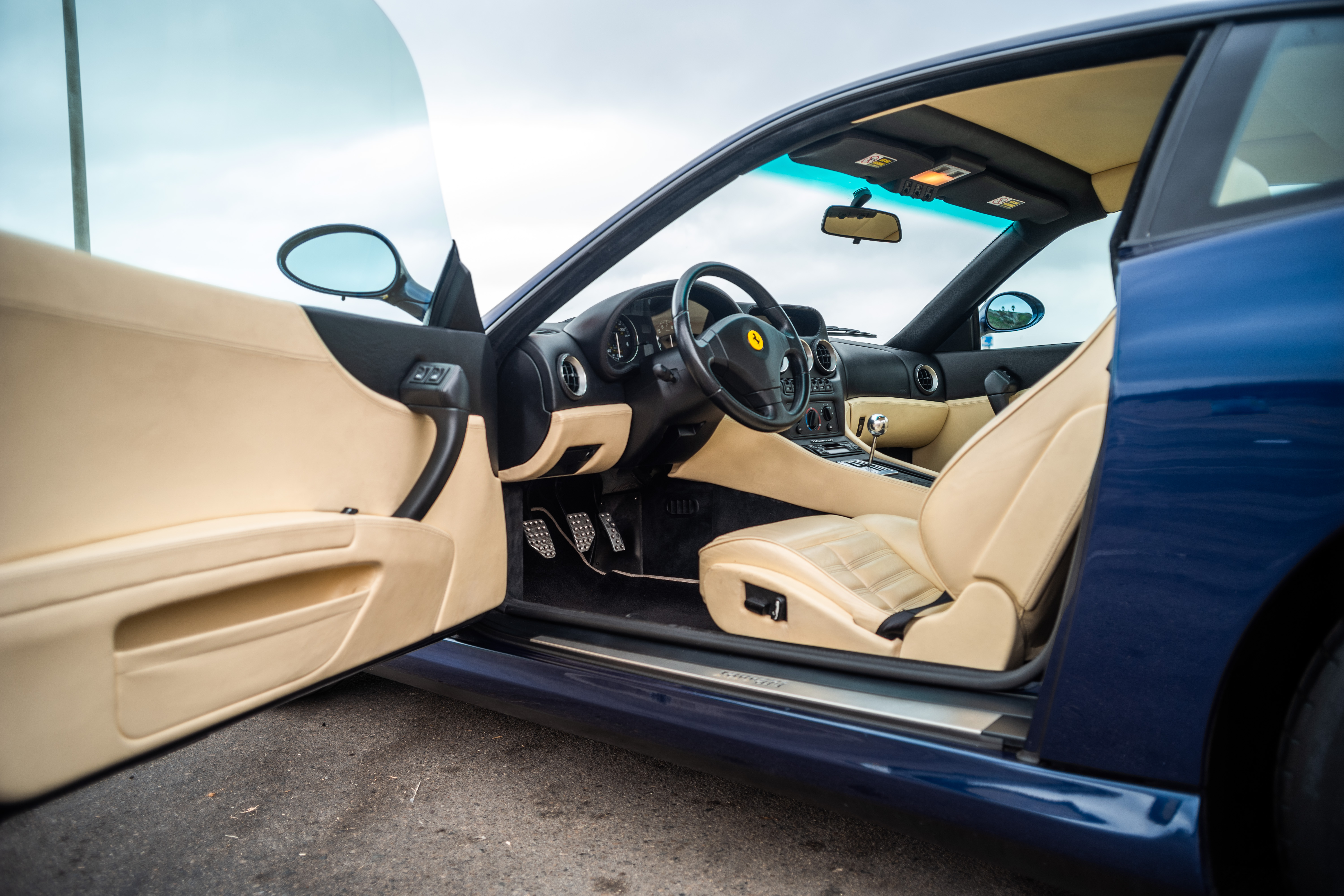 The interior of the 1999 550 Maranello seen from the driver's open door