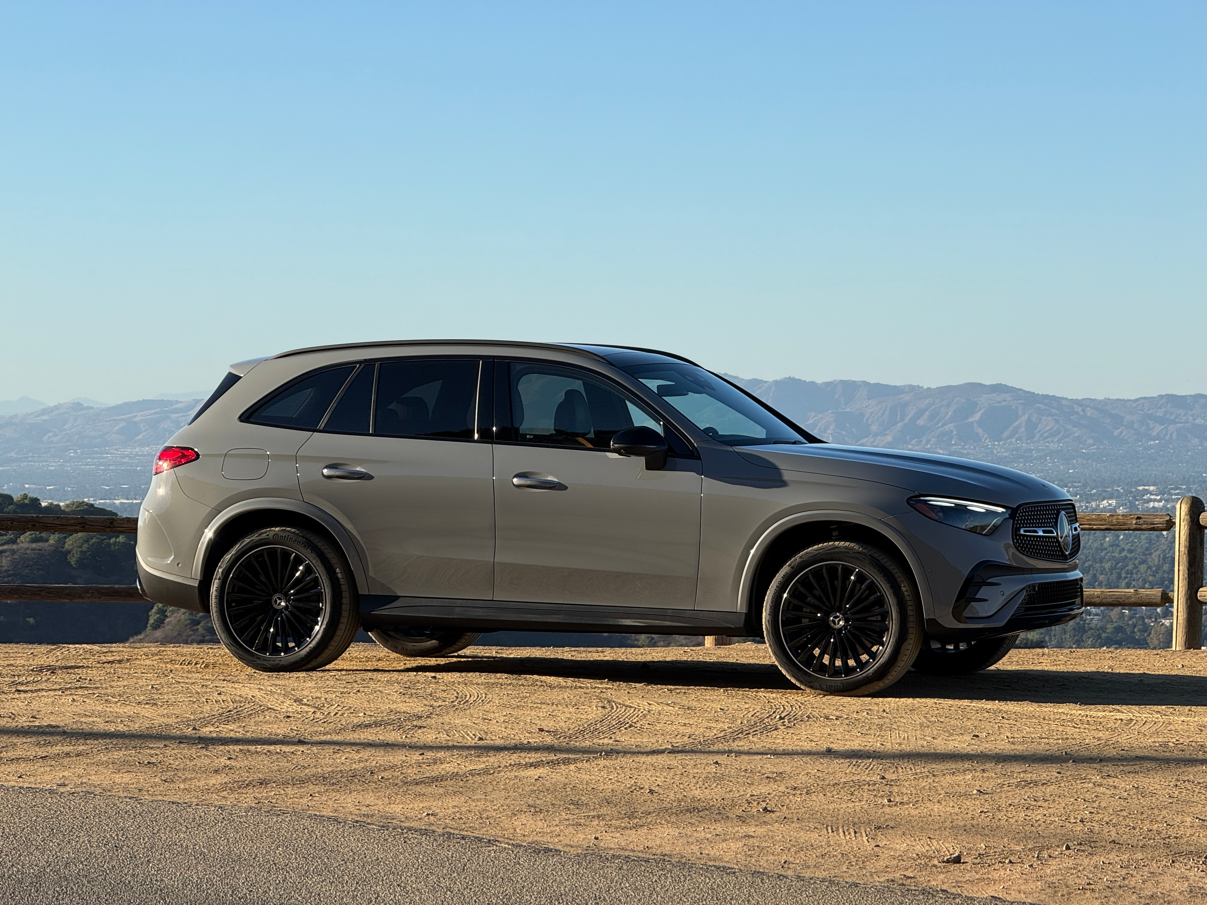 Front 3/4 view of a grey 2025 Mercedes-Benz GLC350e