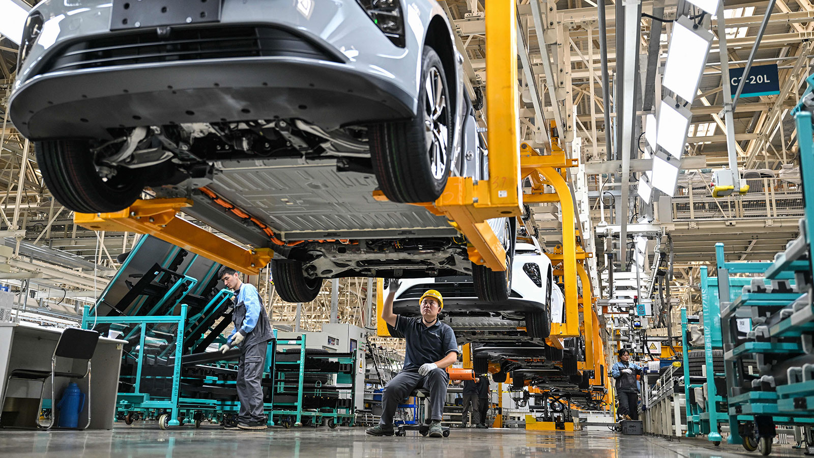 A photo of someone working on a car at the Nio factory in China. 