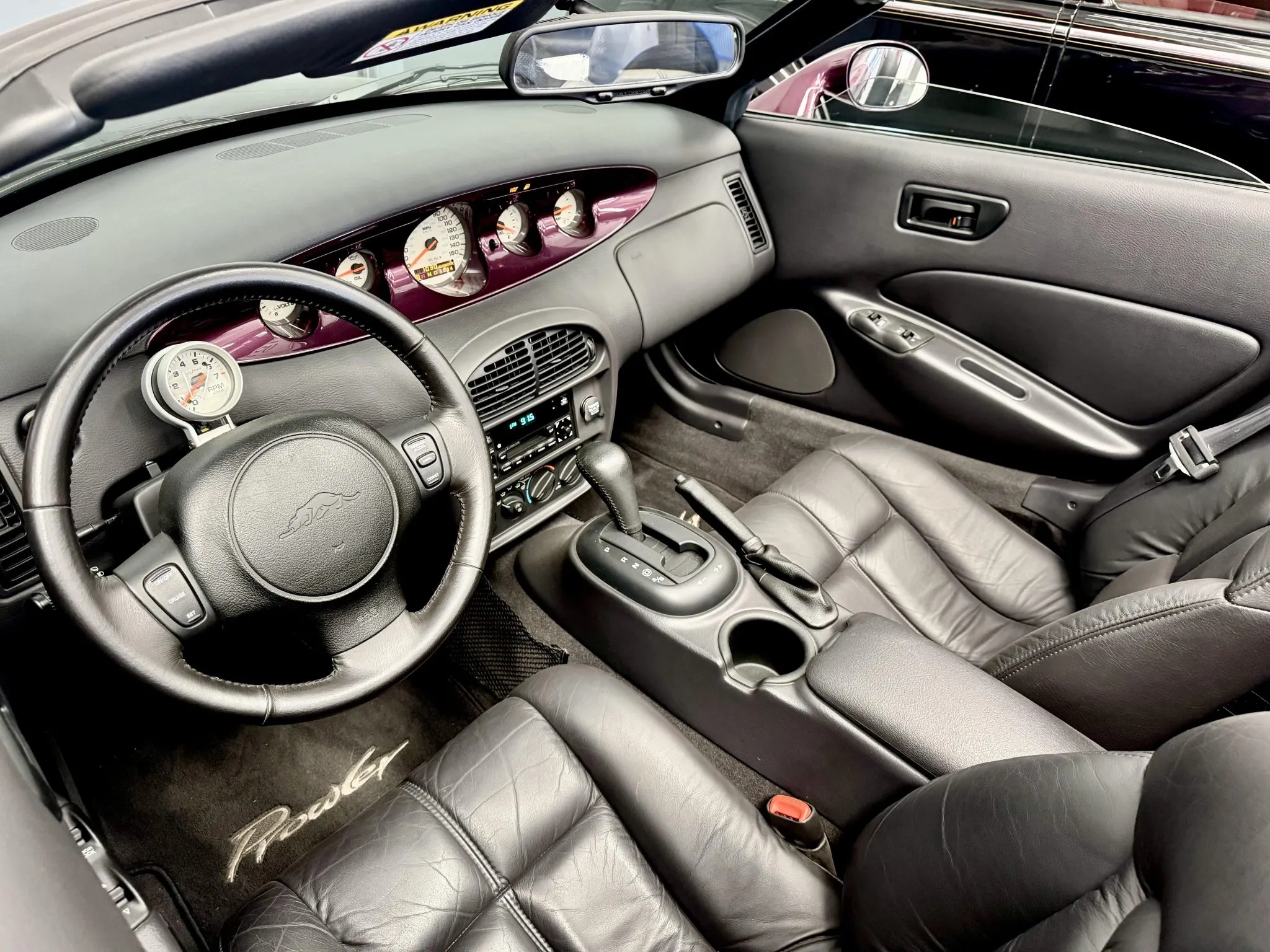 the black leather interior of the 1k mile prowler