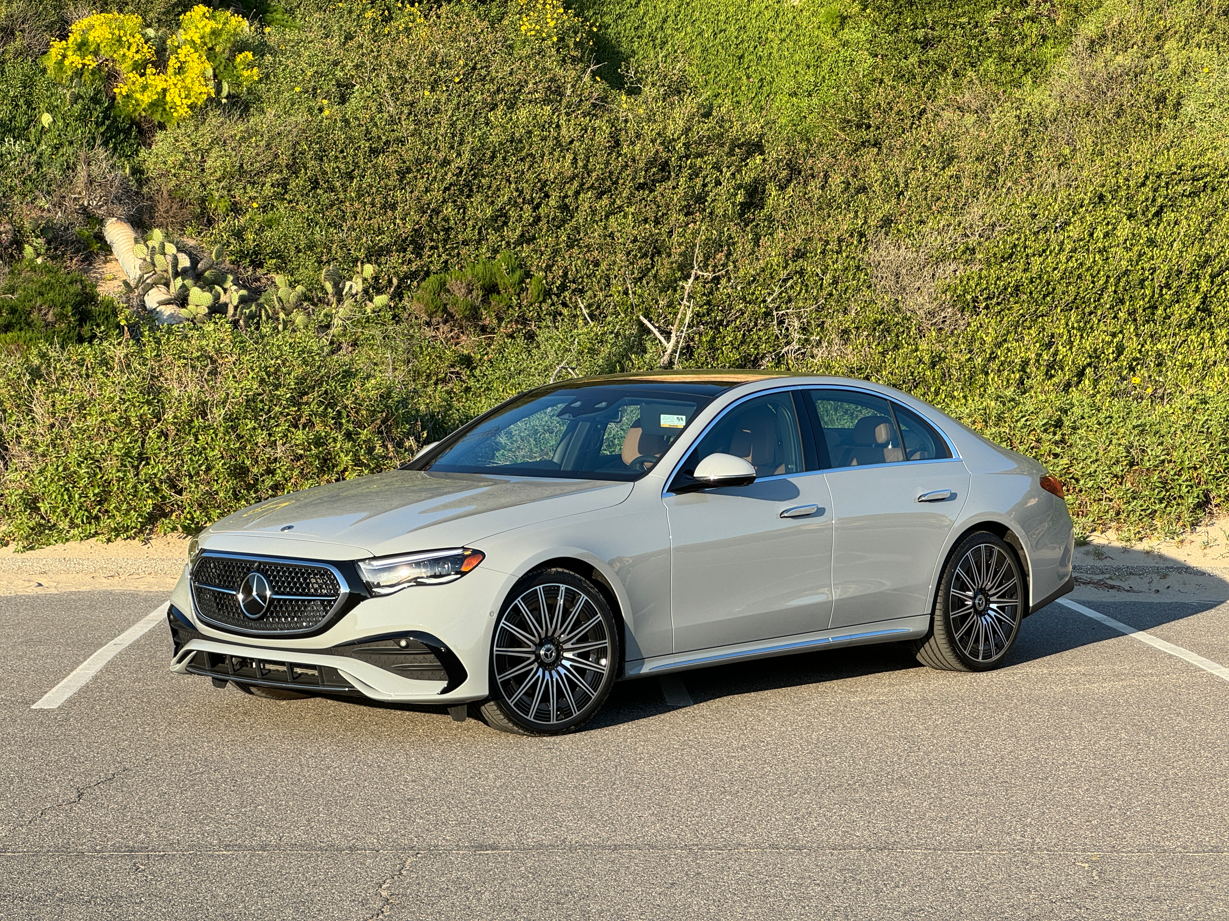 Front 3/4 view of a grey 2024 Mercedes-Benz E350