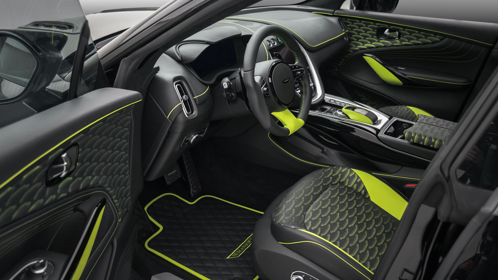 The interior of the Mansory DB is black with lime green detailing 