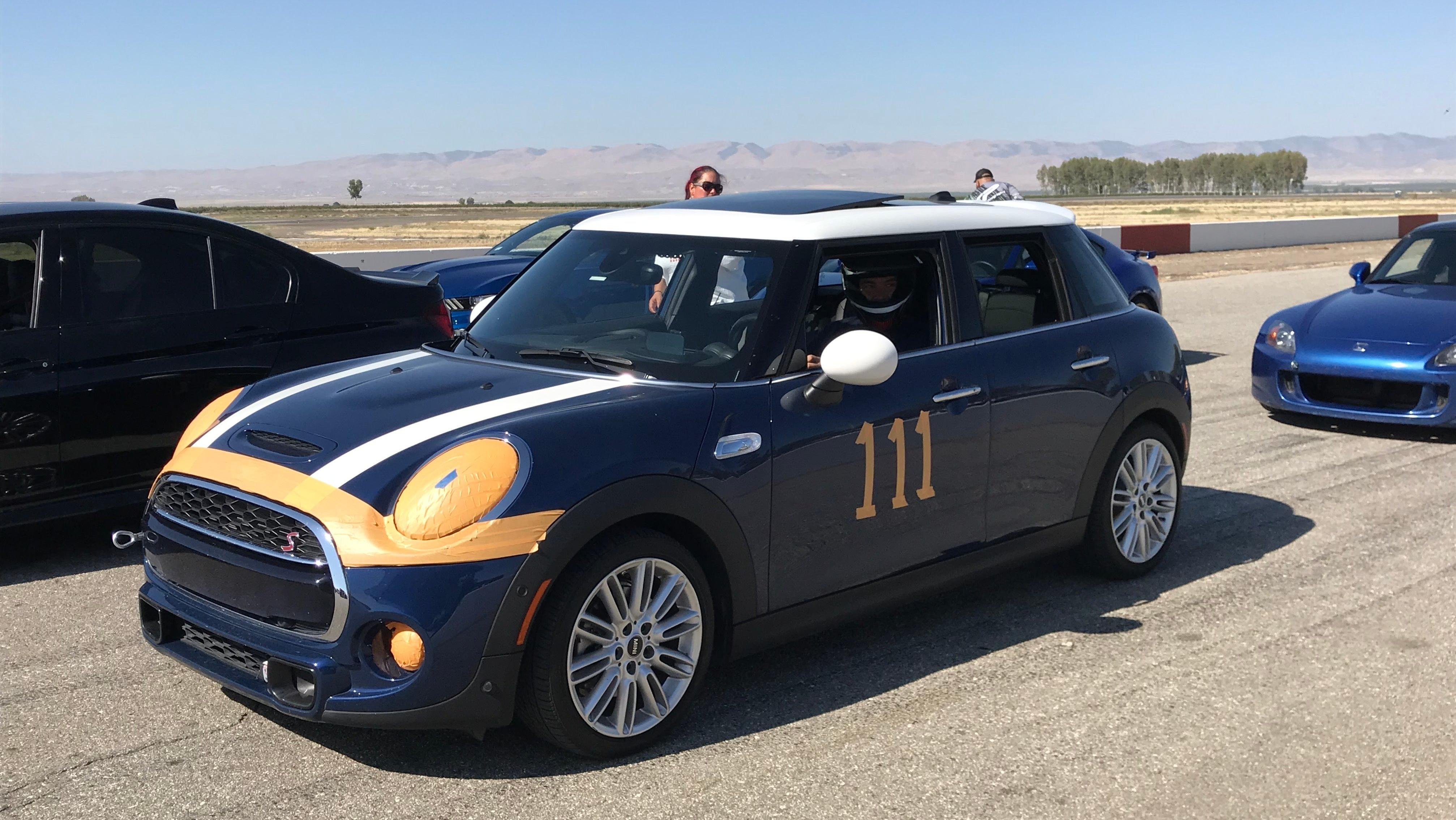 A photo of me in a Mini at Buttonwillow Raceway