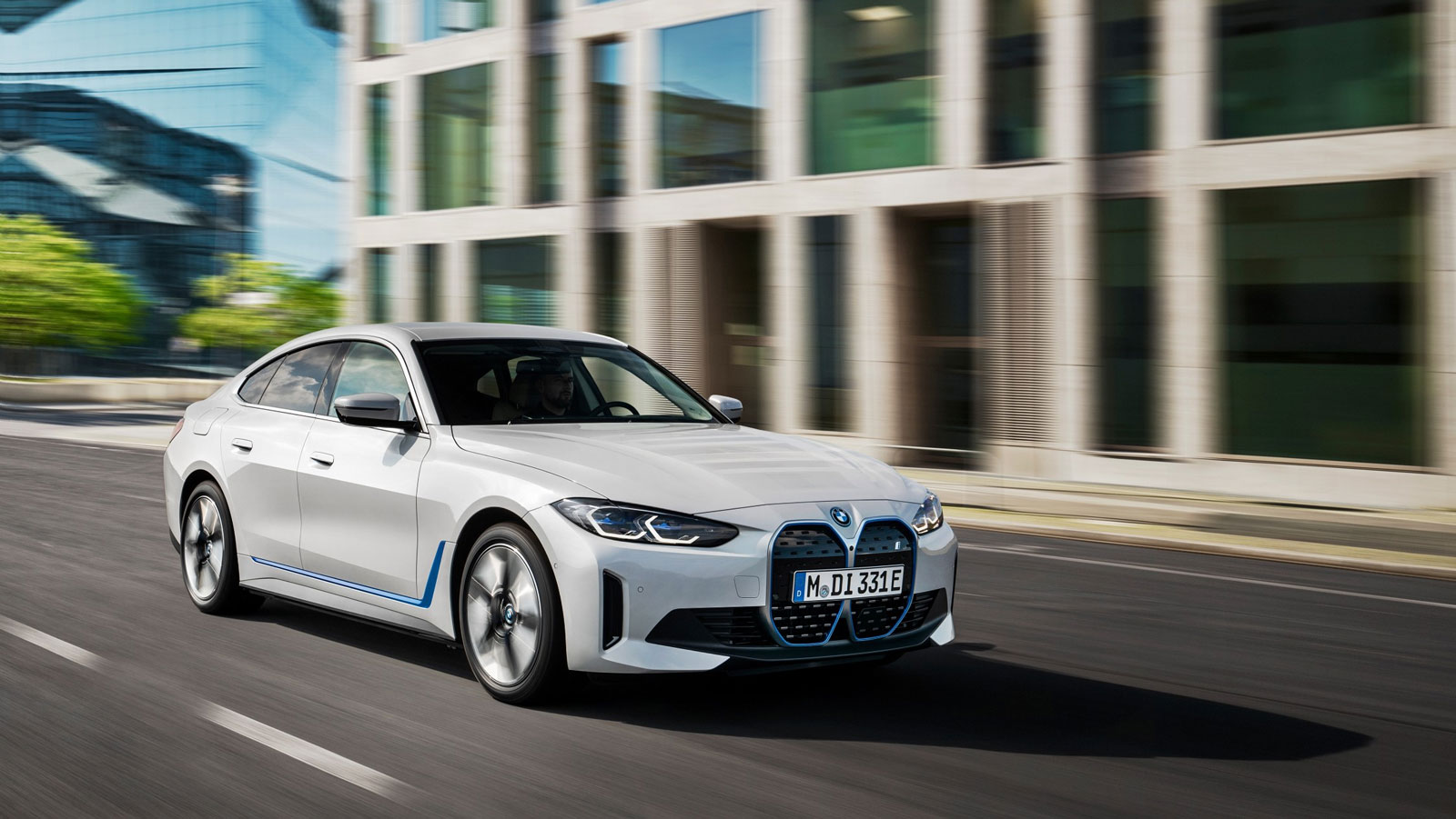 A photo of a white BMW i4 electric sedan.