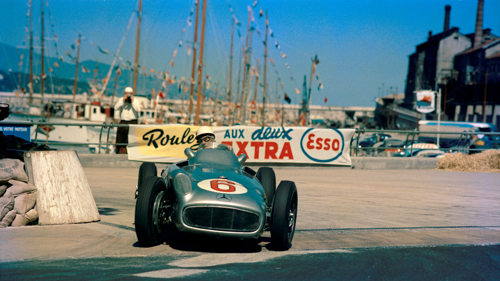 A photo of a 1955 silver Mercedes Formula 1 car. 