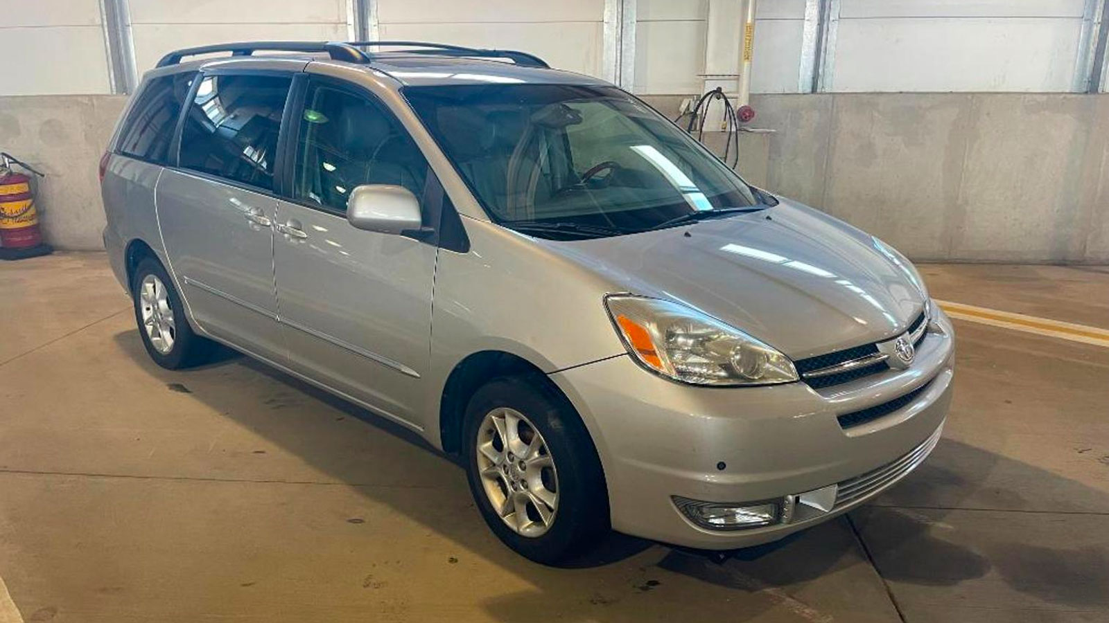 A silver Toyota Sienna minivan 