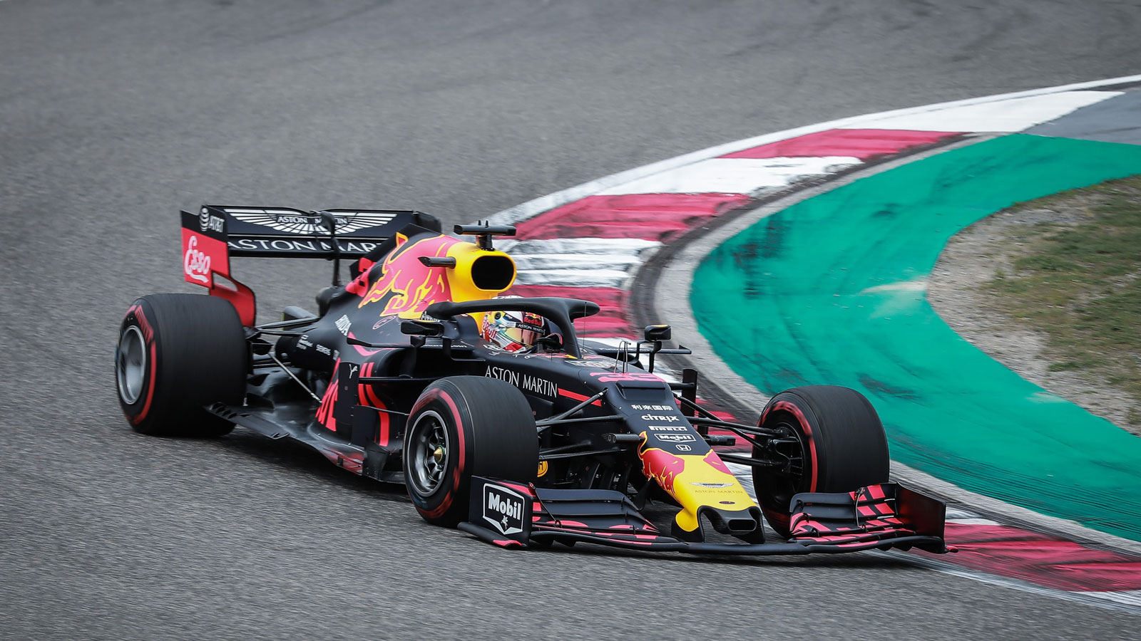 A photo of Max Verstappen racing his Red Bull F1 car in China. 