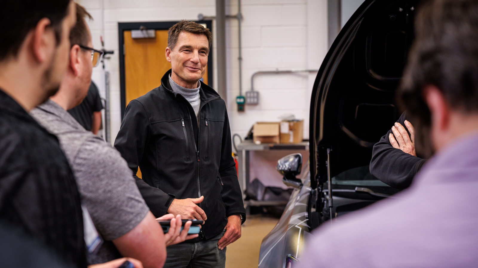 A photo of Polestar boss Thomas Ingenlath in a workshop. 