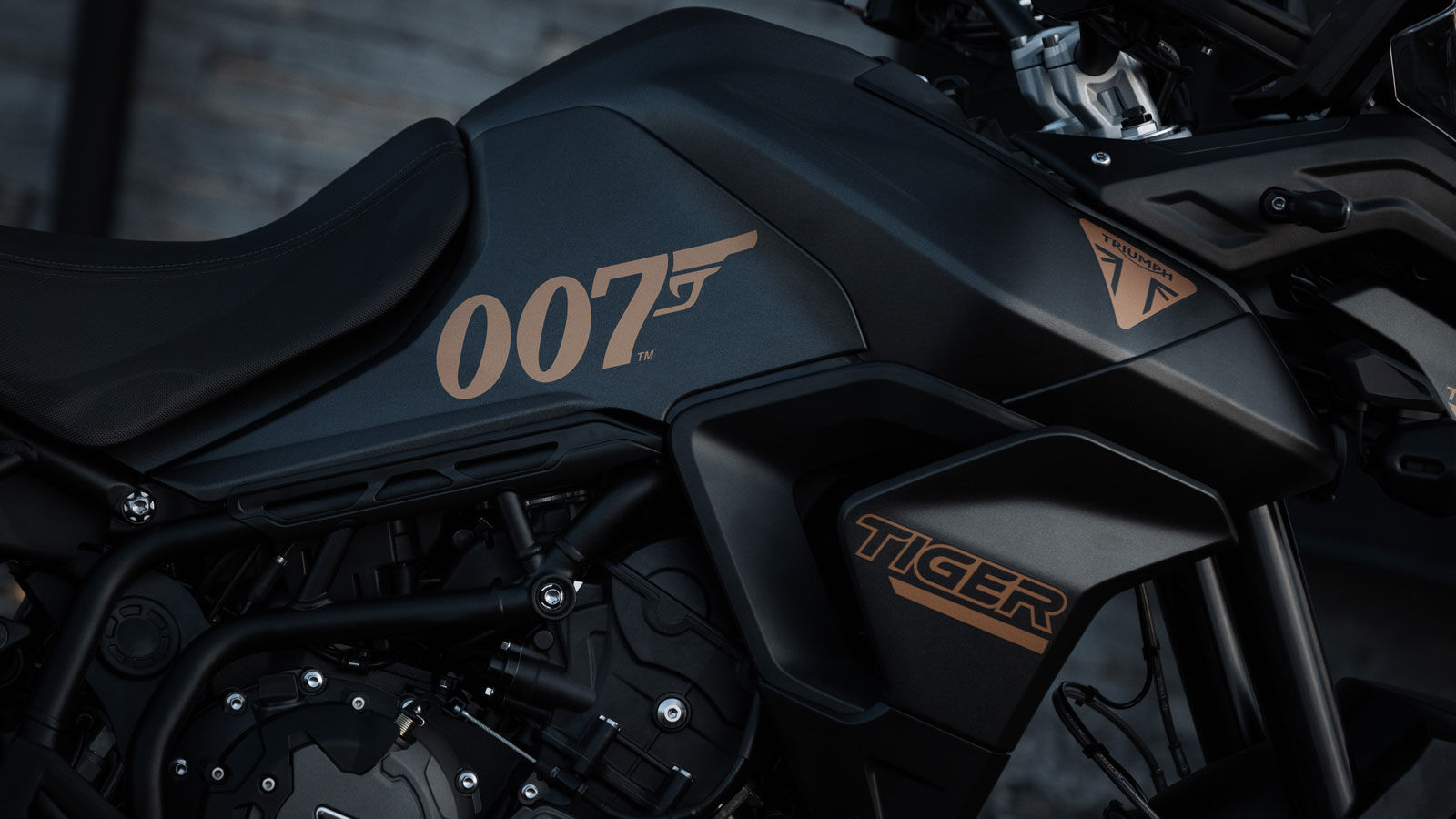 The Triumph Tiger is painted mat black with gold 007 details 