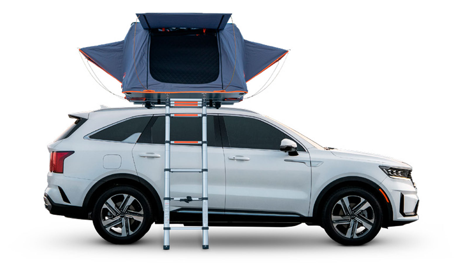 A side profile view of a white Kia SUV with a popped-up Roofnest tent on top. 