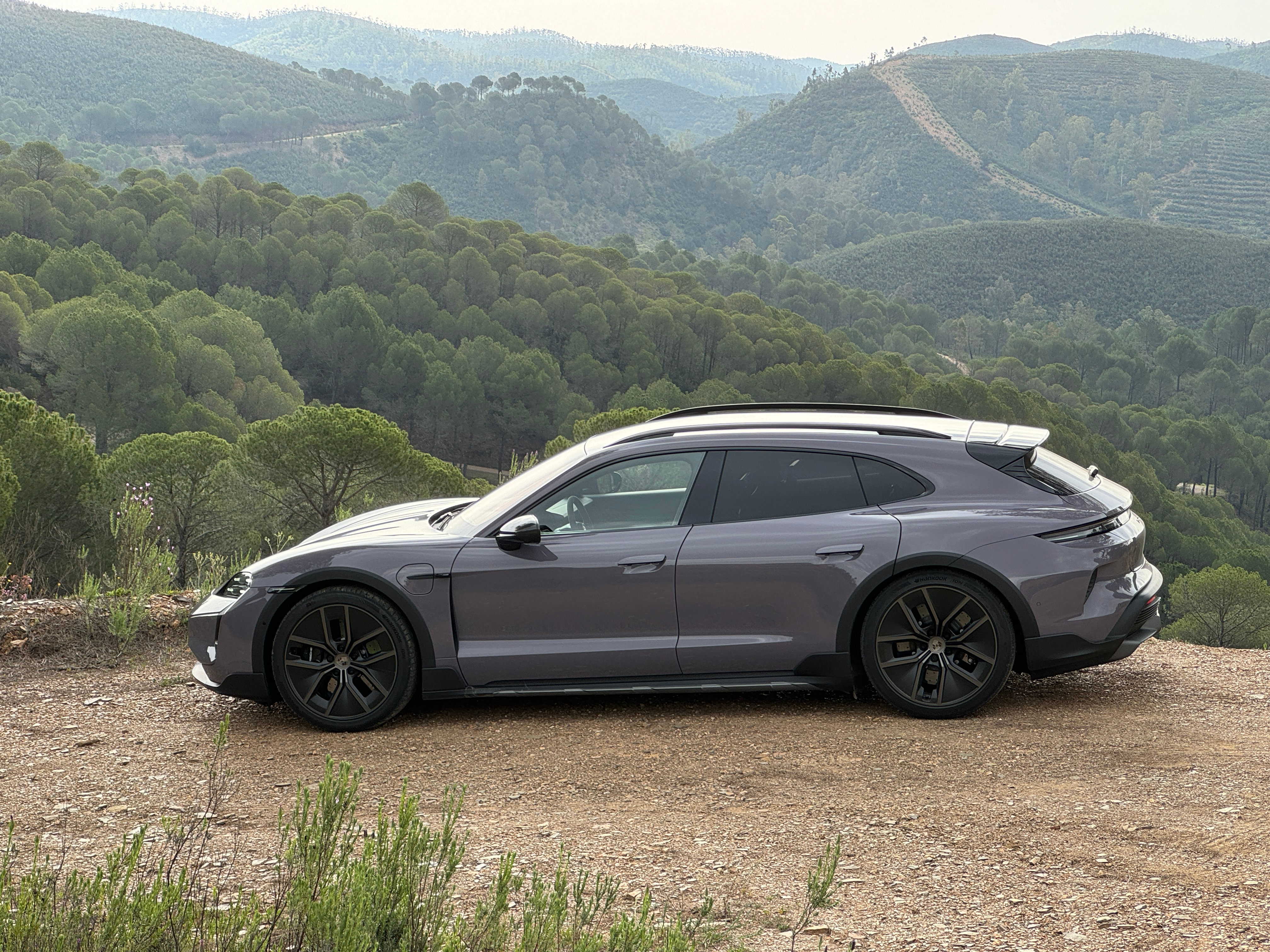 Side view of a lavender 2025 Porsche Taycan Turbo S Cross Turismo