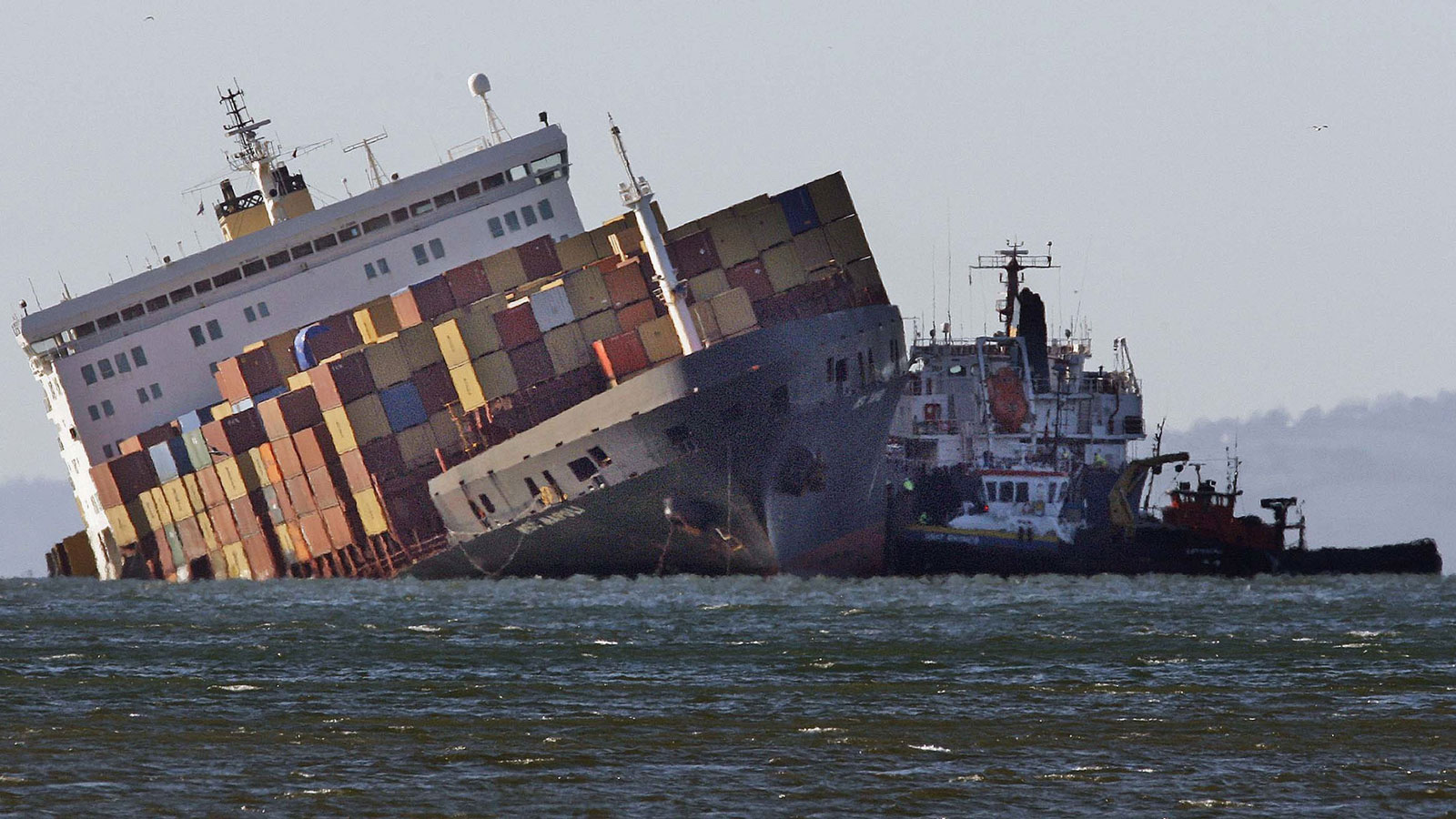 A photo of a container ship sinking off the coast of the UK. 