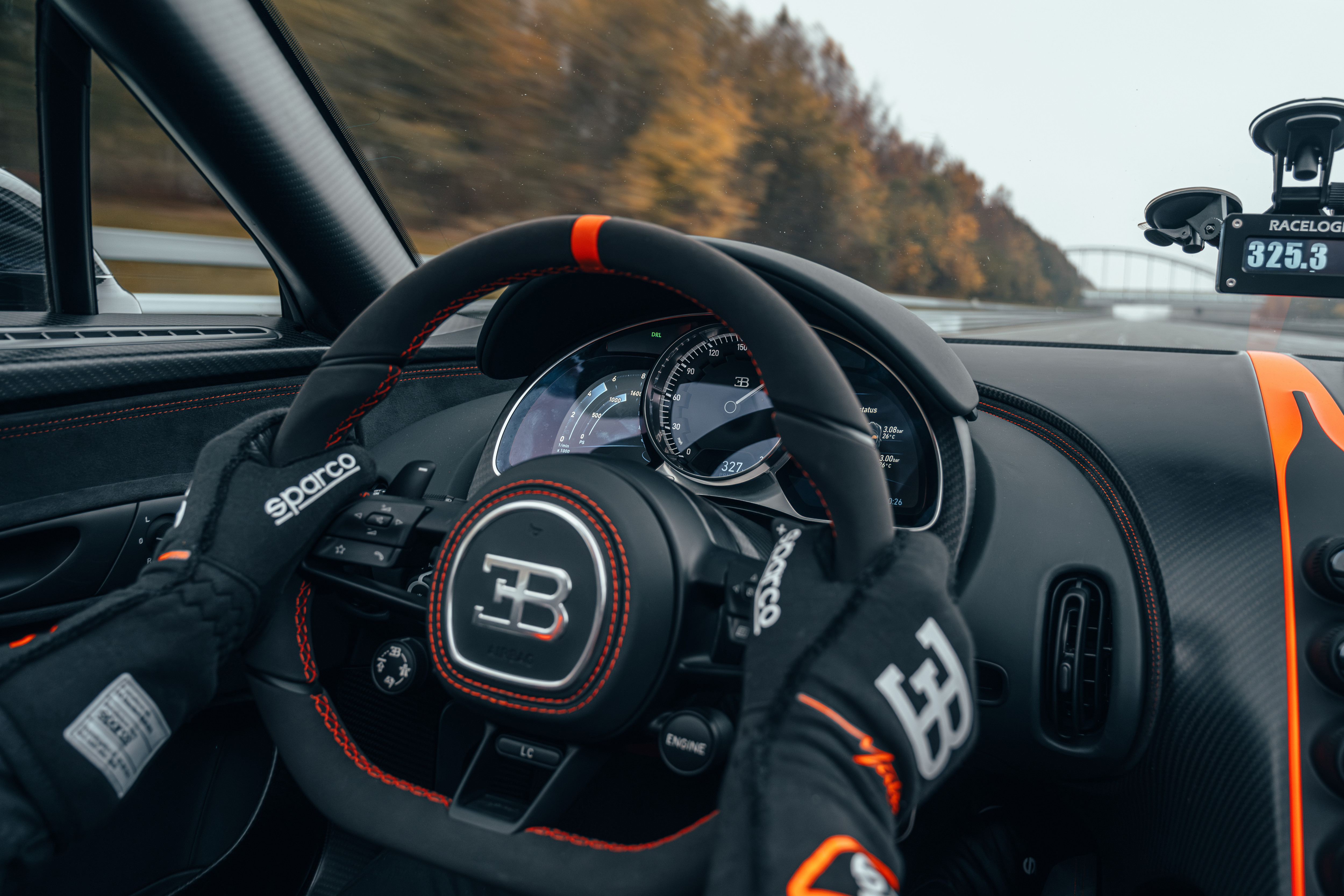 Dashboard of the black and orange Bugatti W16 Mistral World Record Car