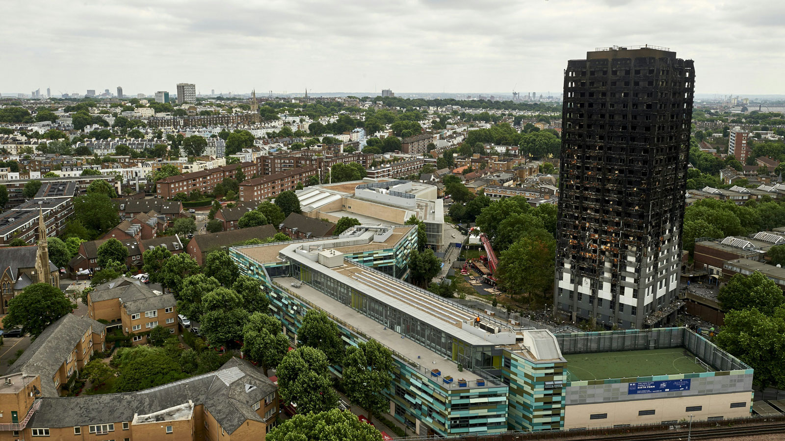 A photo of the London skyline featuring the remains of Grenfell Tower 