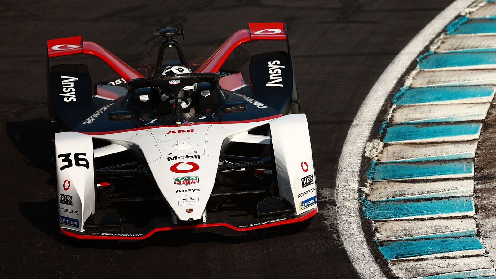 The Porsche Formula E car on a race track 