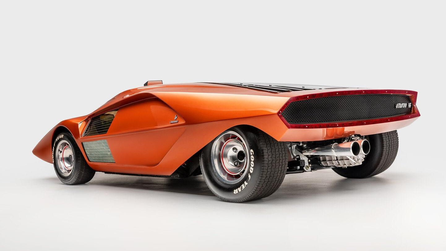 Rear 3/4 view of the orange Lancia Stratos Zero concept