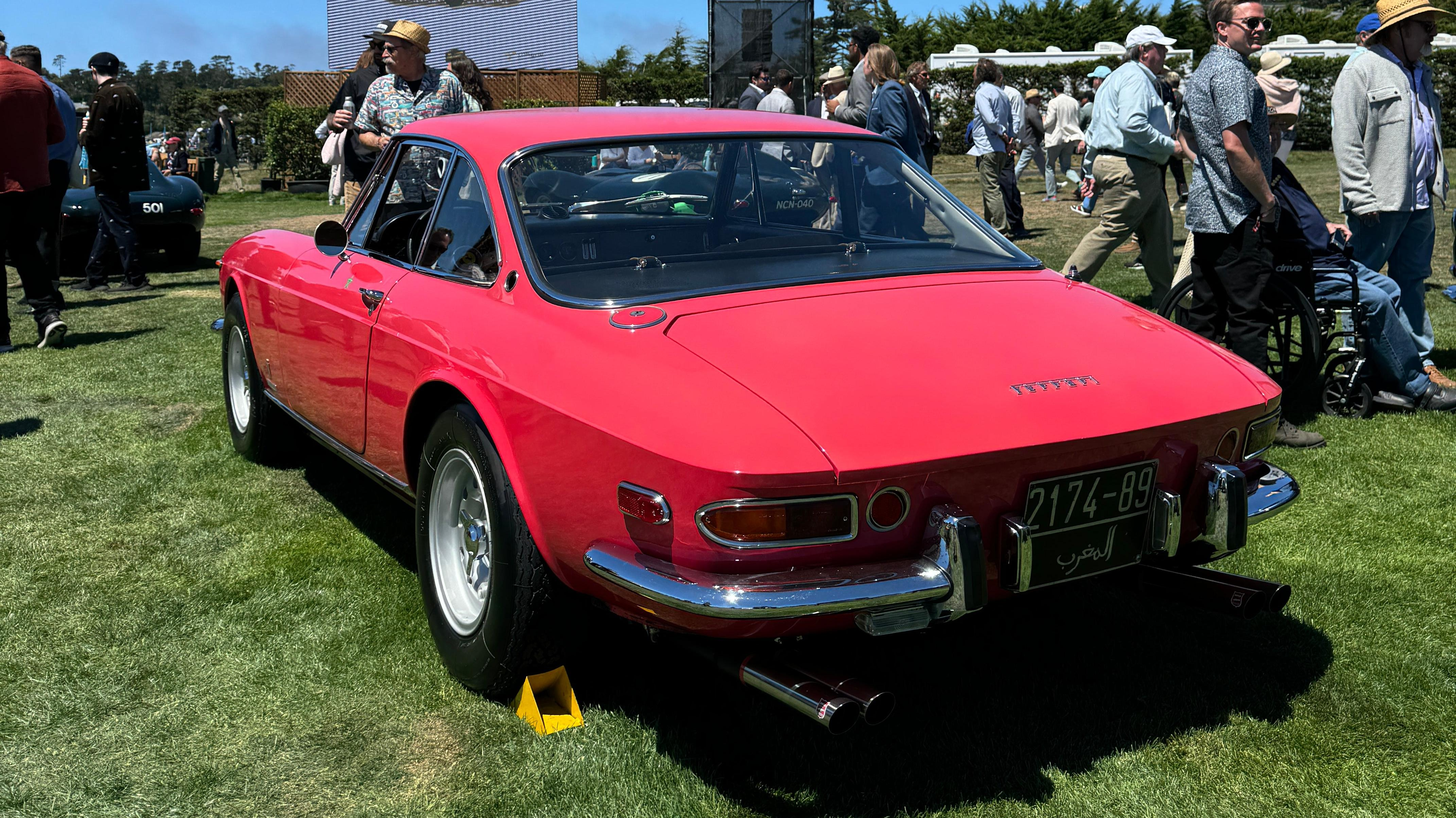 Rear 3/4 view of a Lipstick Coral Ferrari 365 GTC