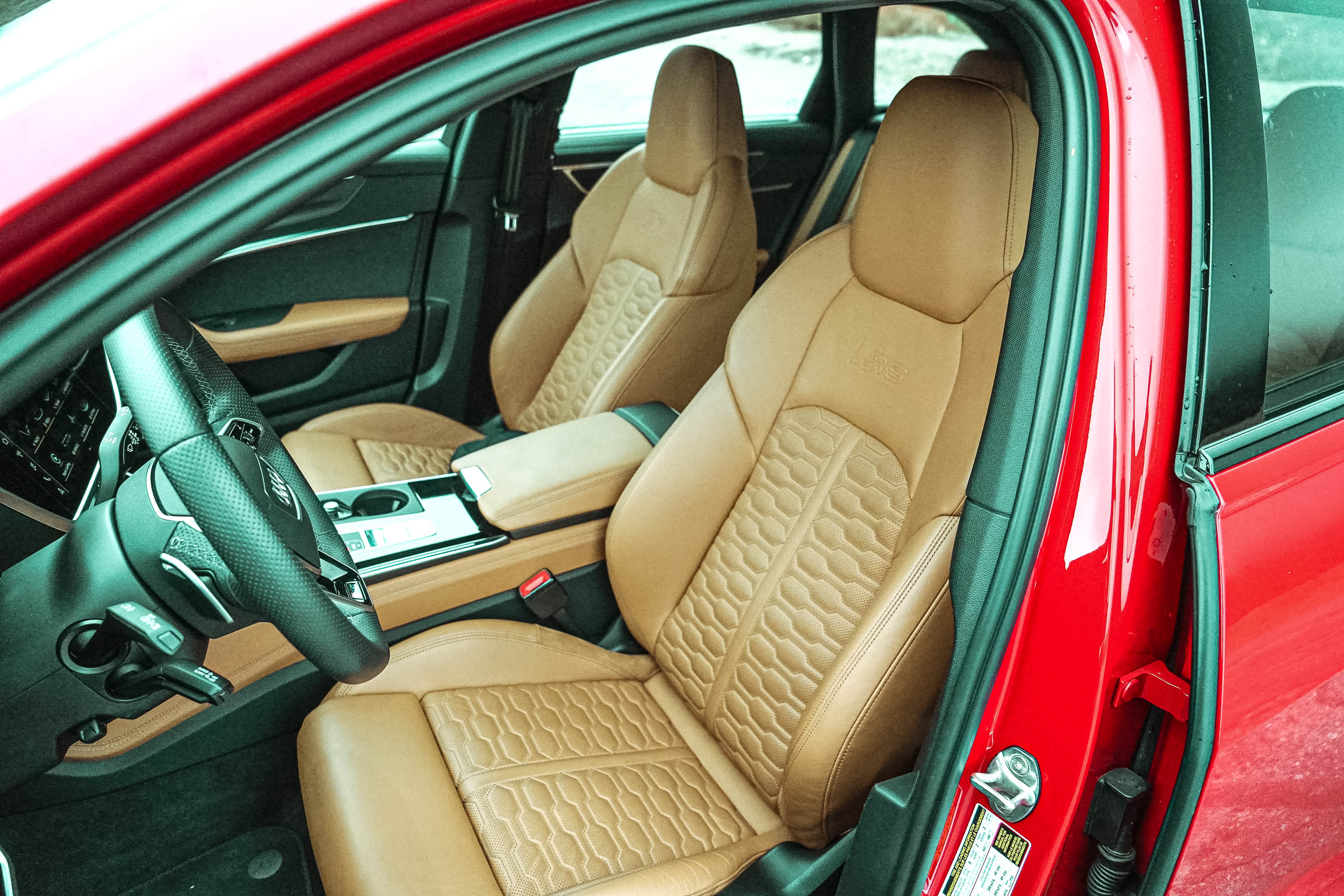 The brown quilted leather bucket seats of the 2022 Audi RS 6 Avant