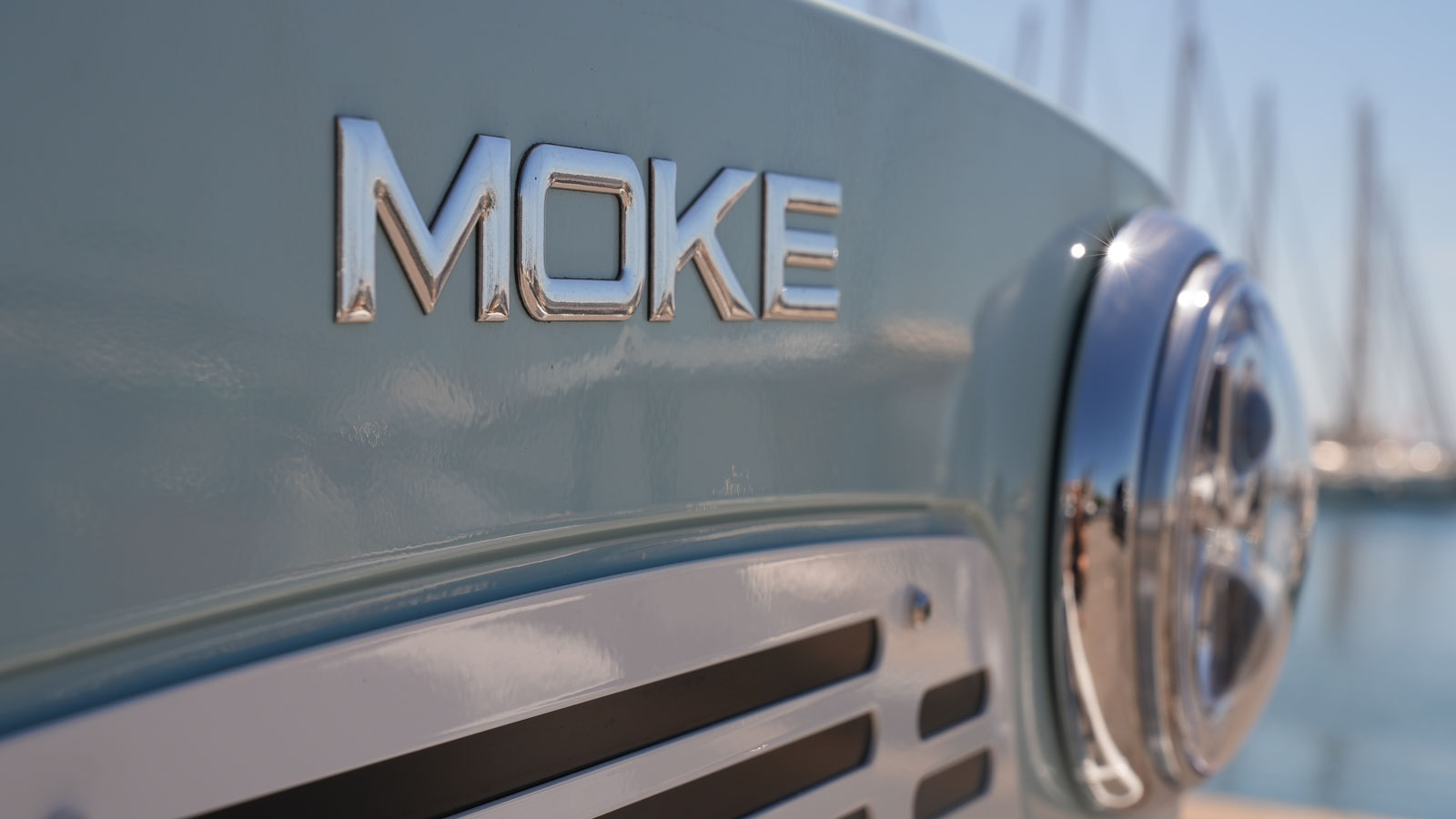  A photo of the Moke badge on the front of an EV> 